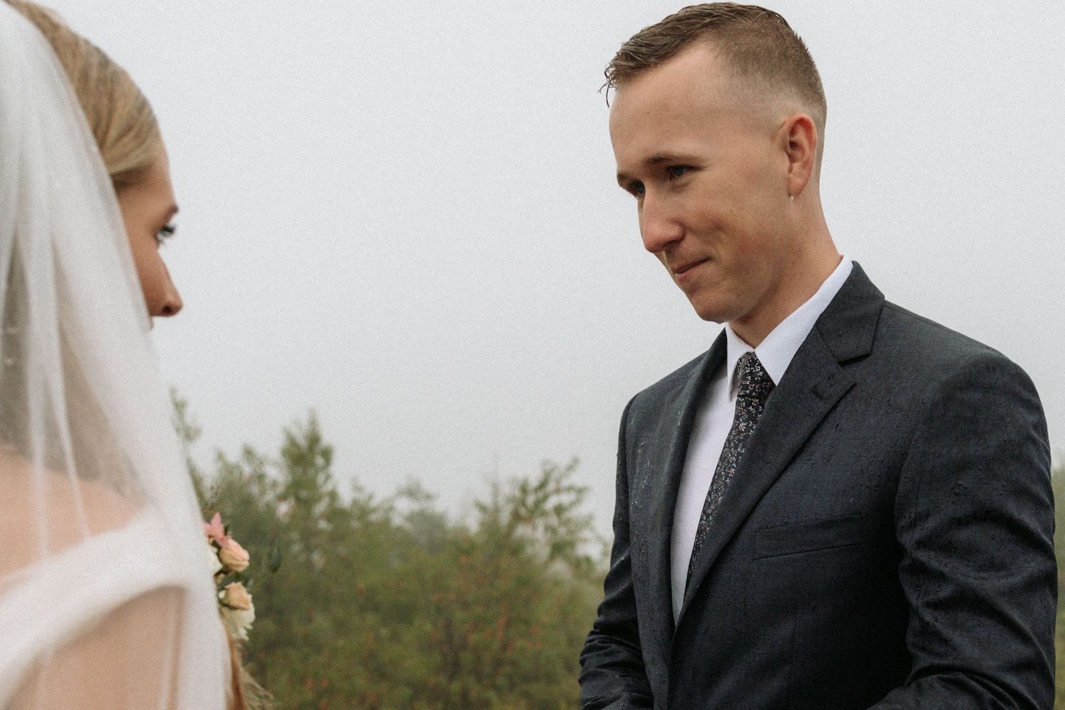 groom looking at bride