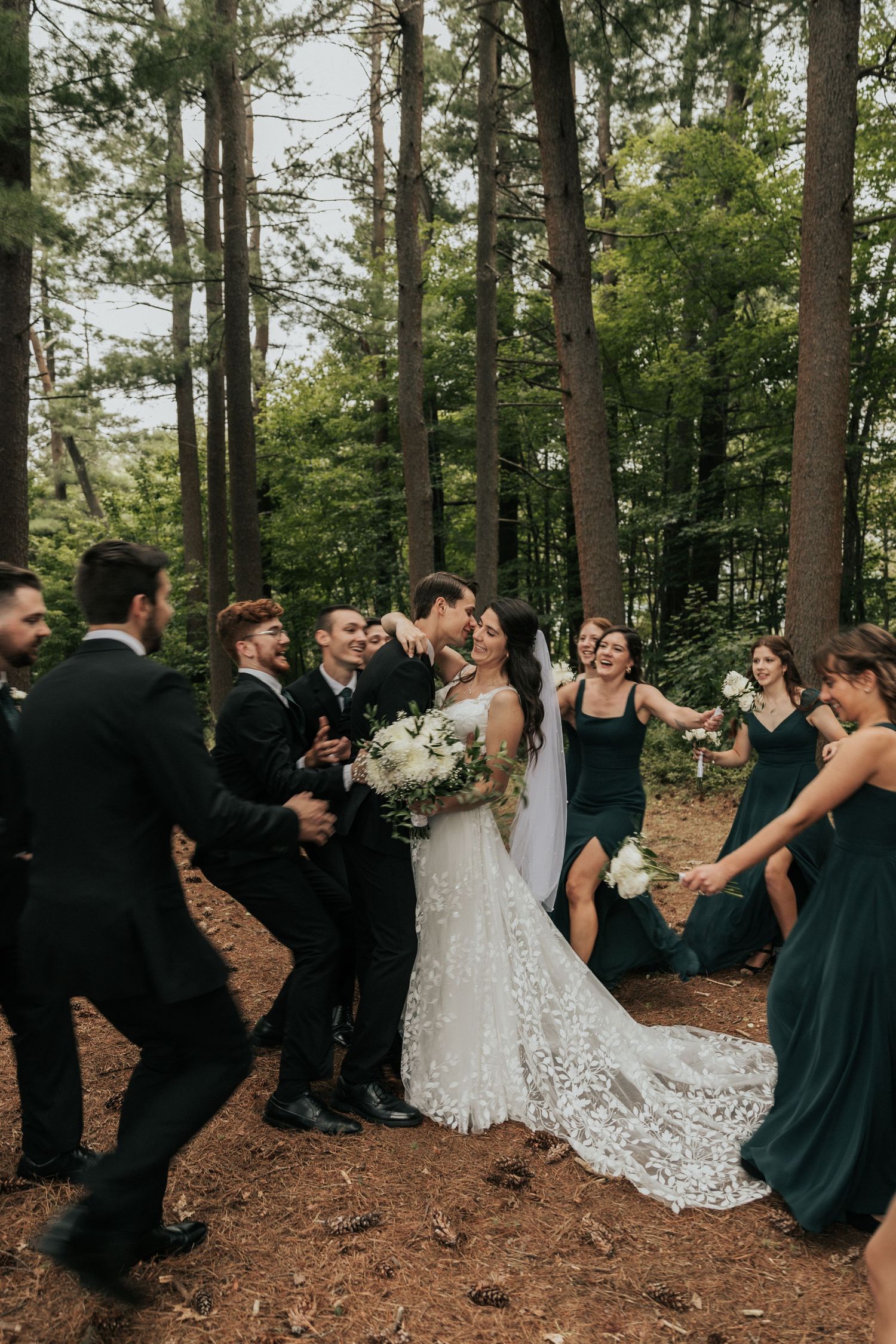 Bridal party swarming couple