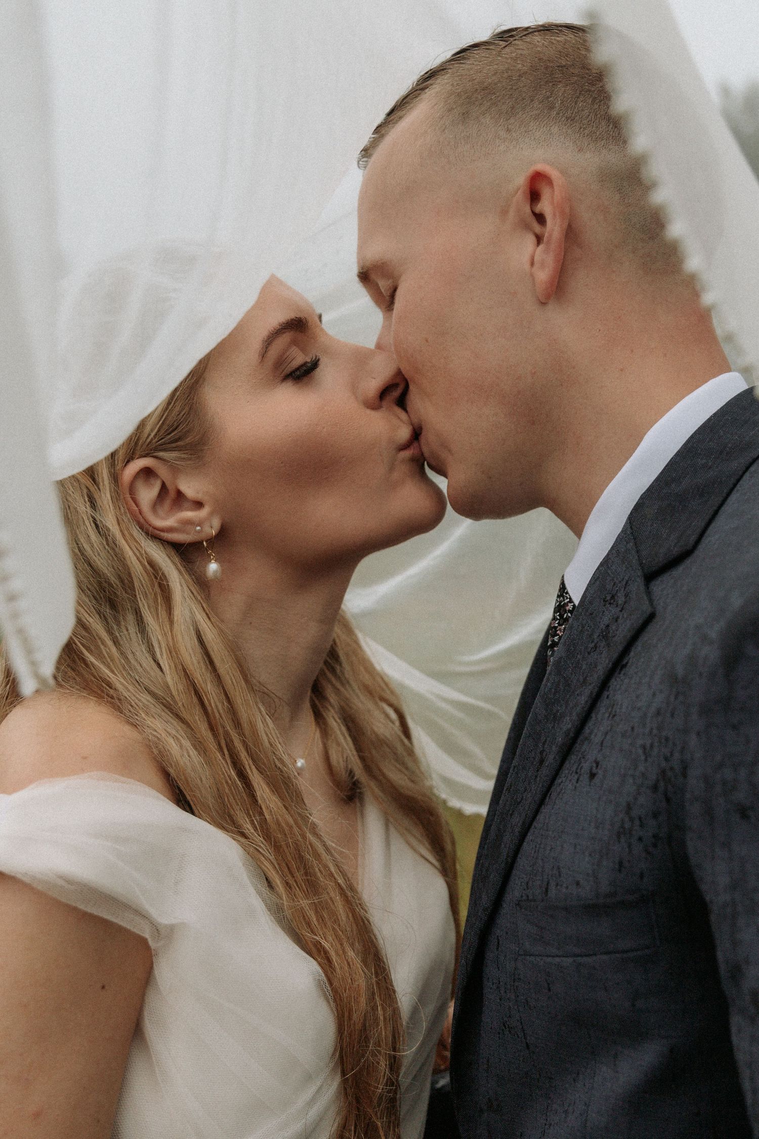 Wedding couple sharing intimate kisses in a series of romantic portraits.
