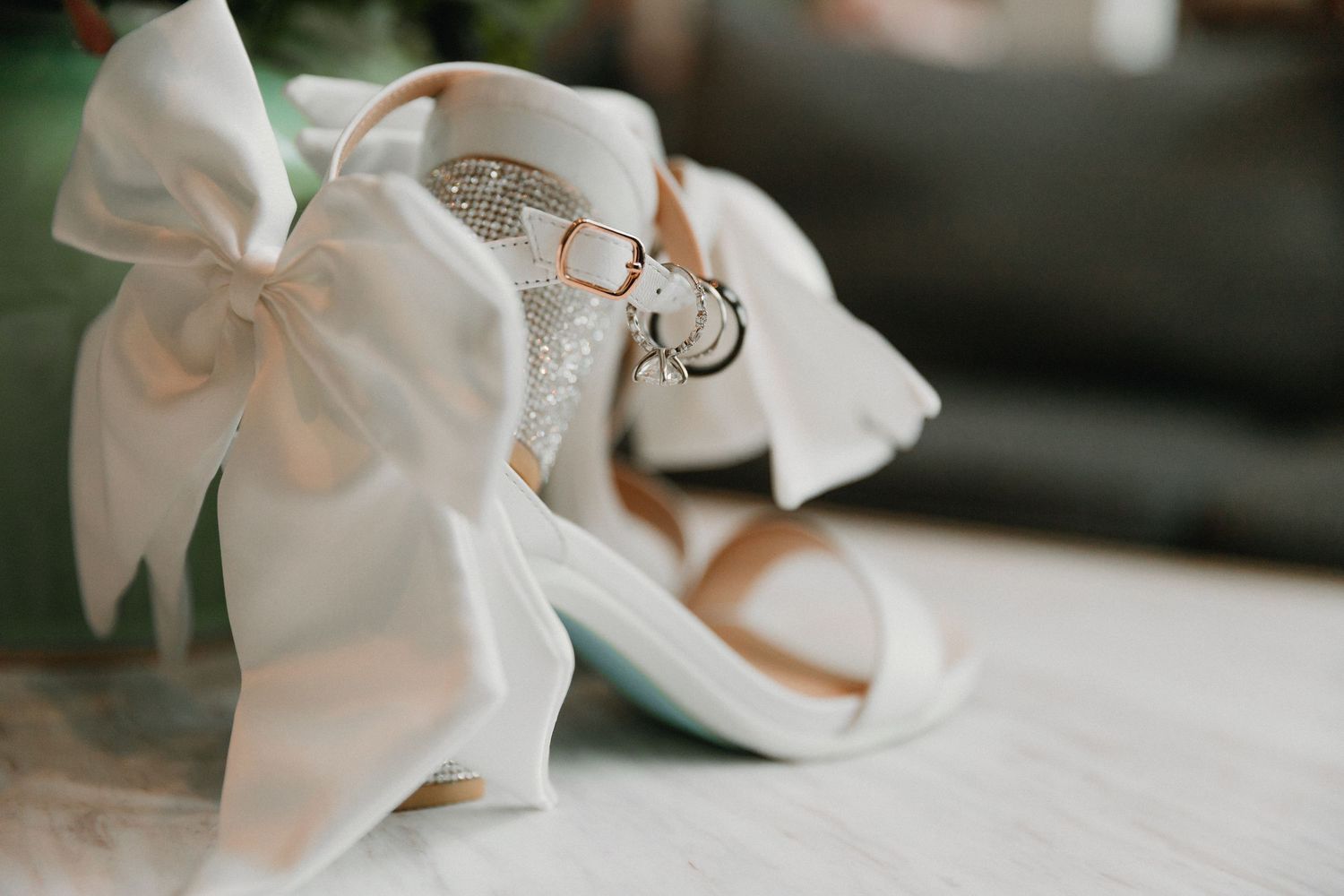 White satin bow details and accessories for a wedding.