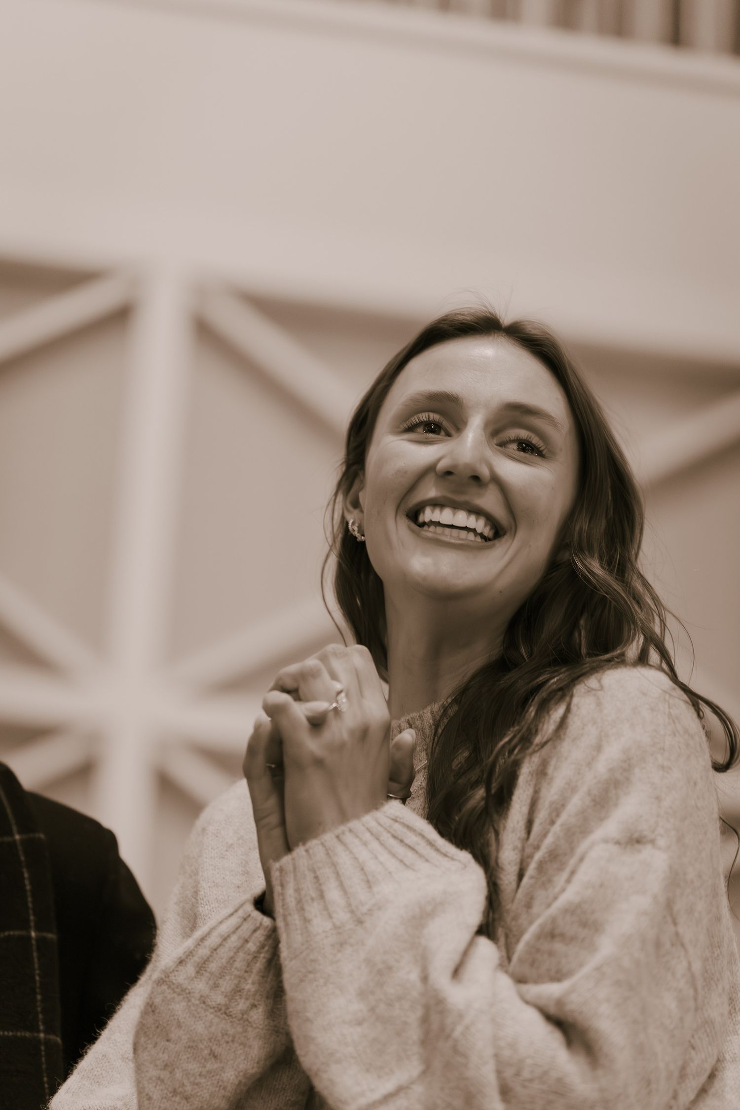 A series of candid shots showing genuine laughter and joy in warm sepia tones.