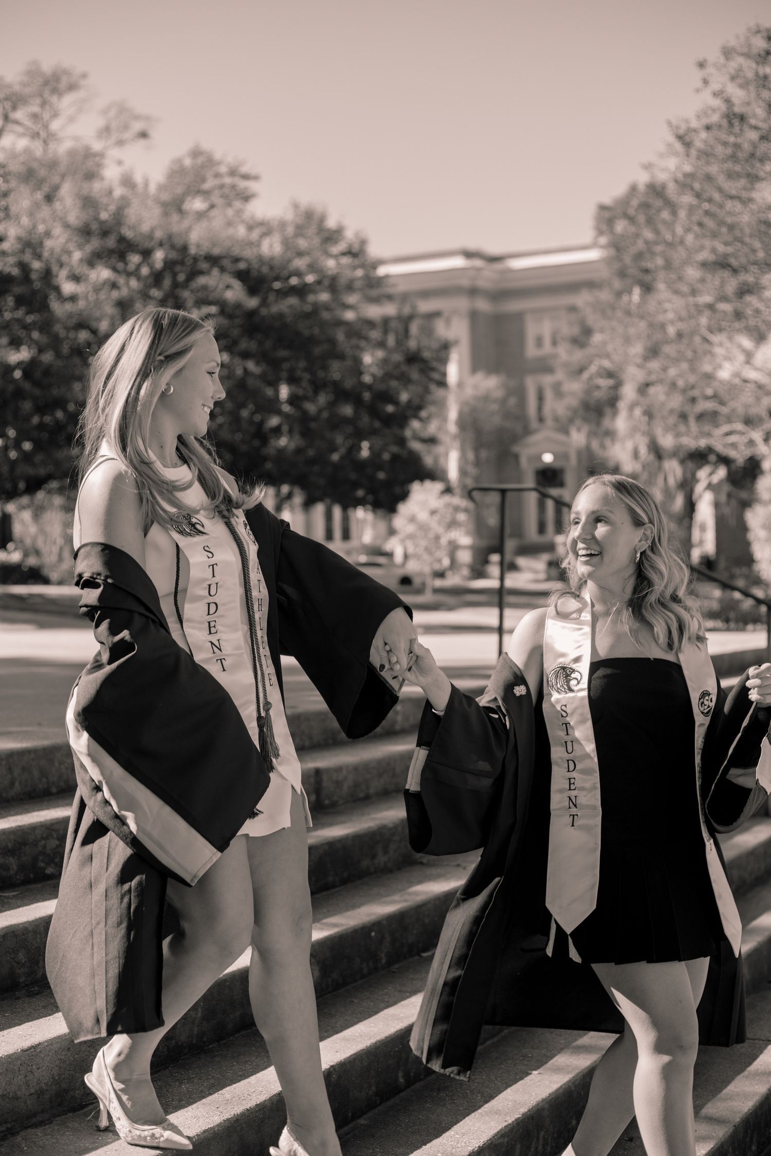 Candid black and white sequence of friends laughing and walking together outdoors.