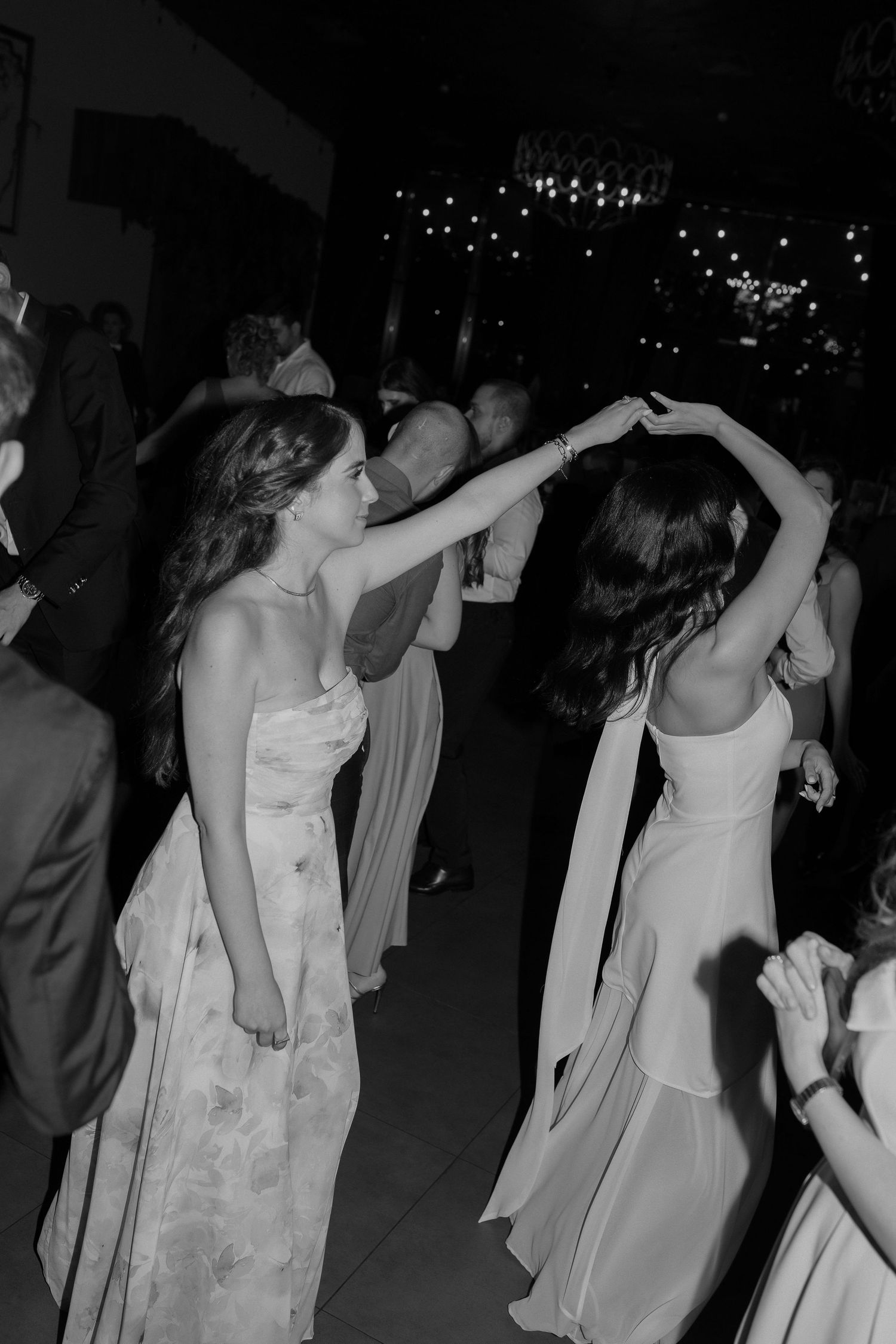 A series of black and white photos showing people dancing at what appears to be a wedding reception or formal party.