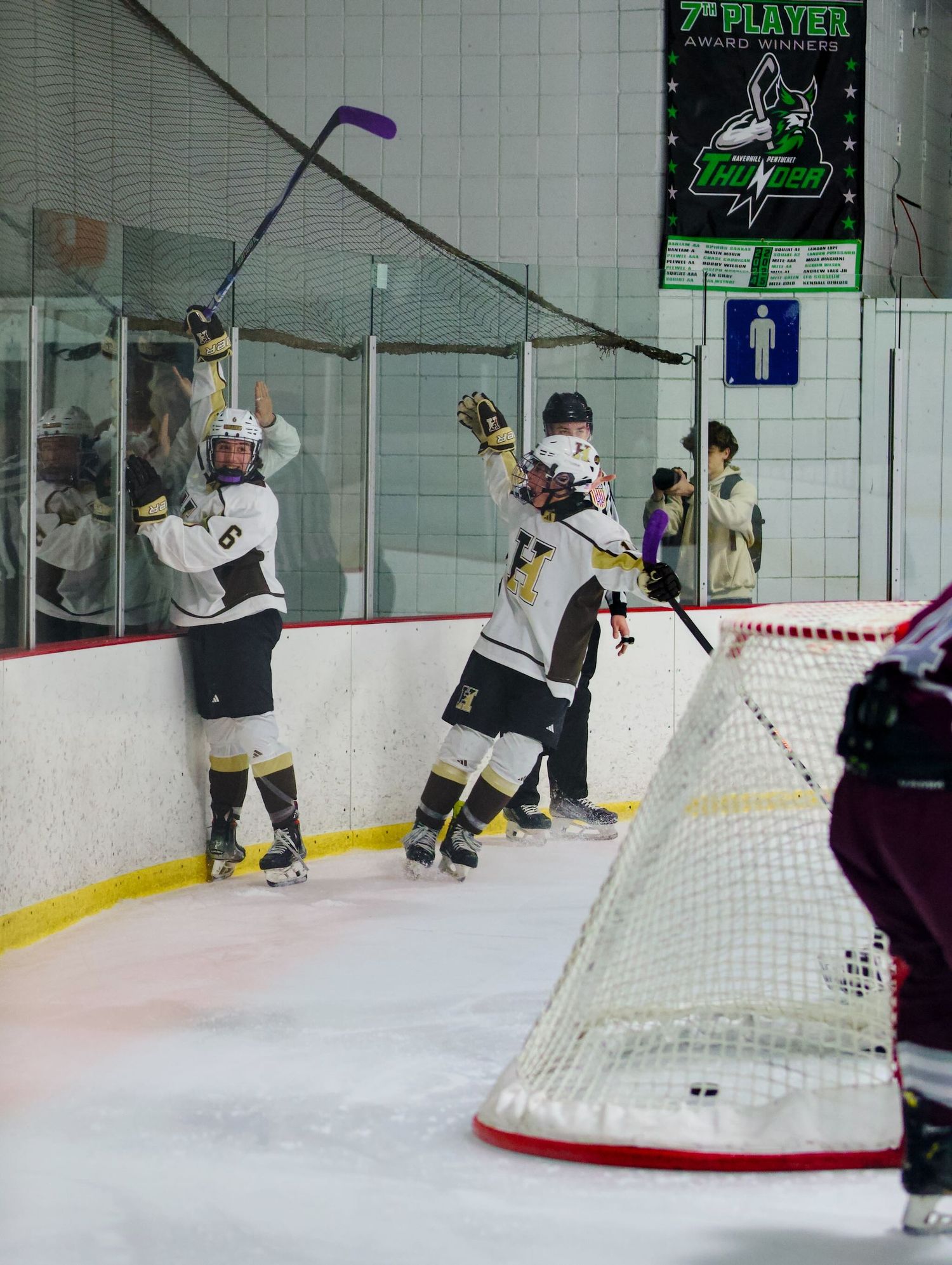 Haverhill hockey player celebrates with a teammate after scoring.