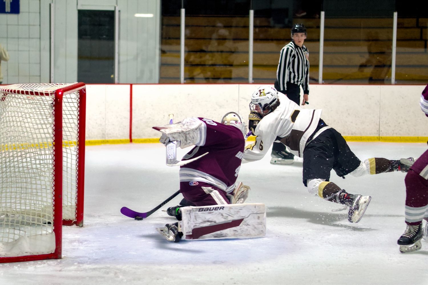 Haverhill Hockey player scoring a diving goal.