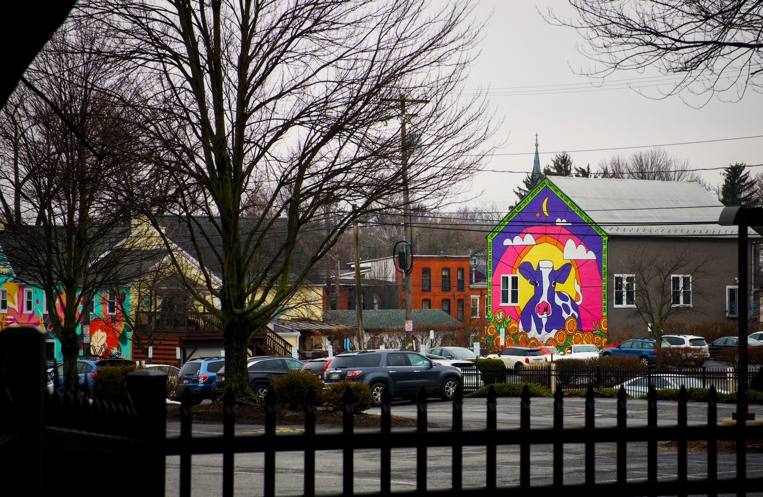 Colorful mural of a cow on a building in Lancaster.
