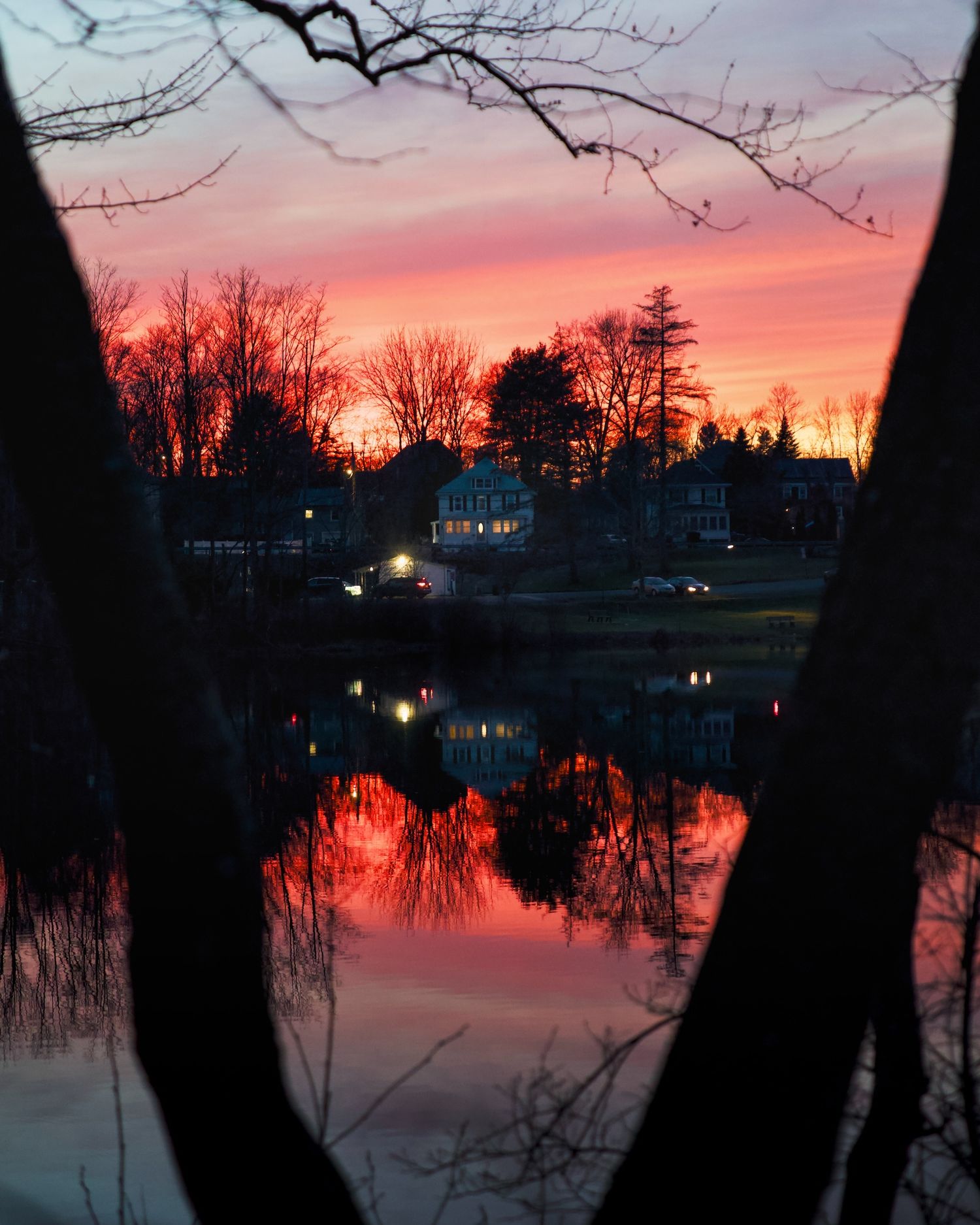 Sunset of house along a lake in Haverhill.