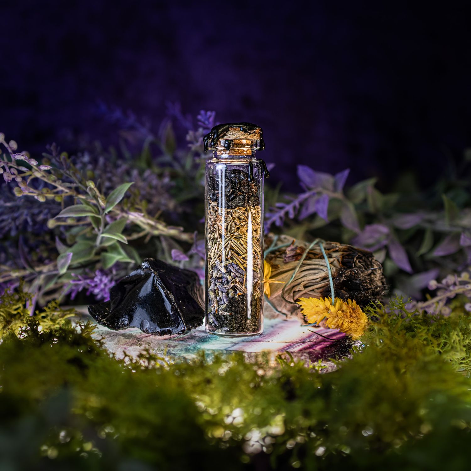 Beauty products displayed with purple flowers and decorative lighting in a dark setting.