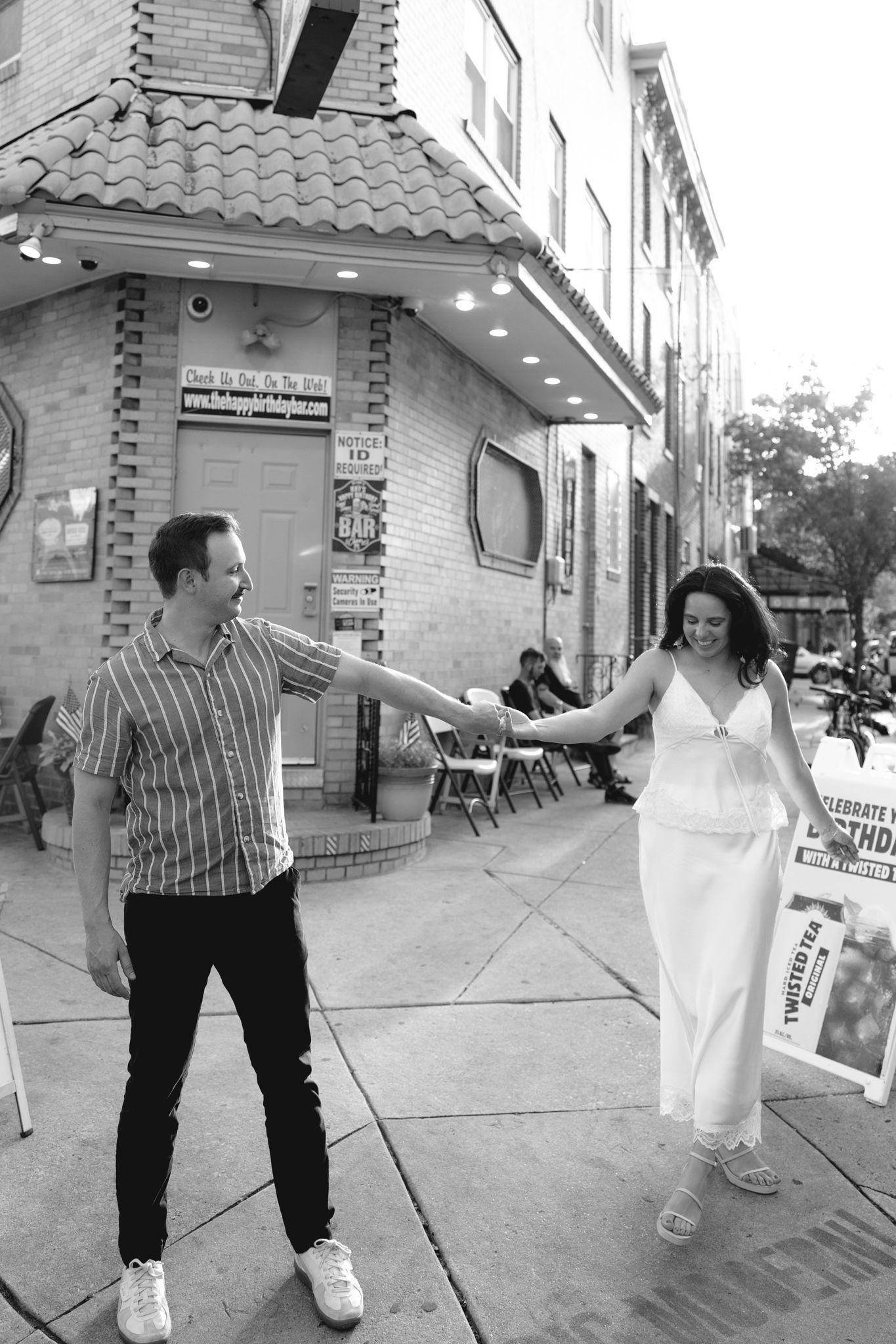 Couple holding hands during an engagement session at Rittenhouse Square in Philadelphia, Pennsylvania-3.jpg