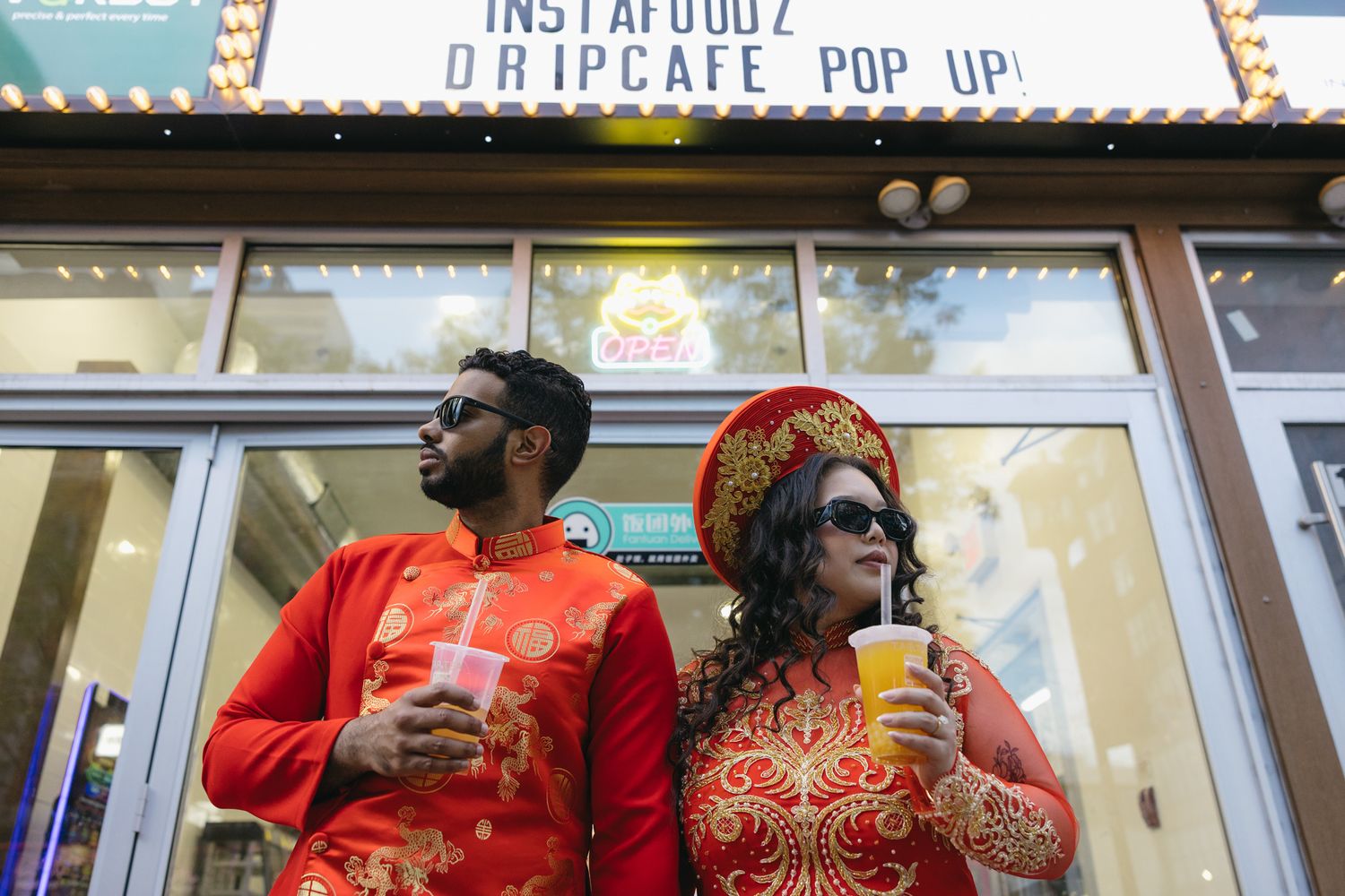 Engaged couple holding hands while strolling through Chinatown in Philadelphia during a candid engagement session-1.jpg