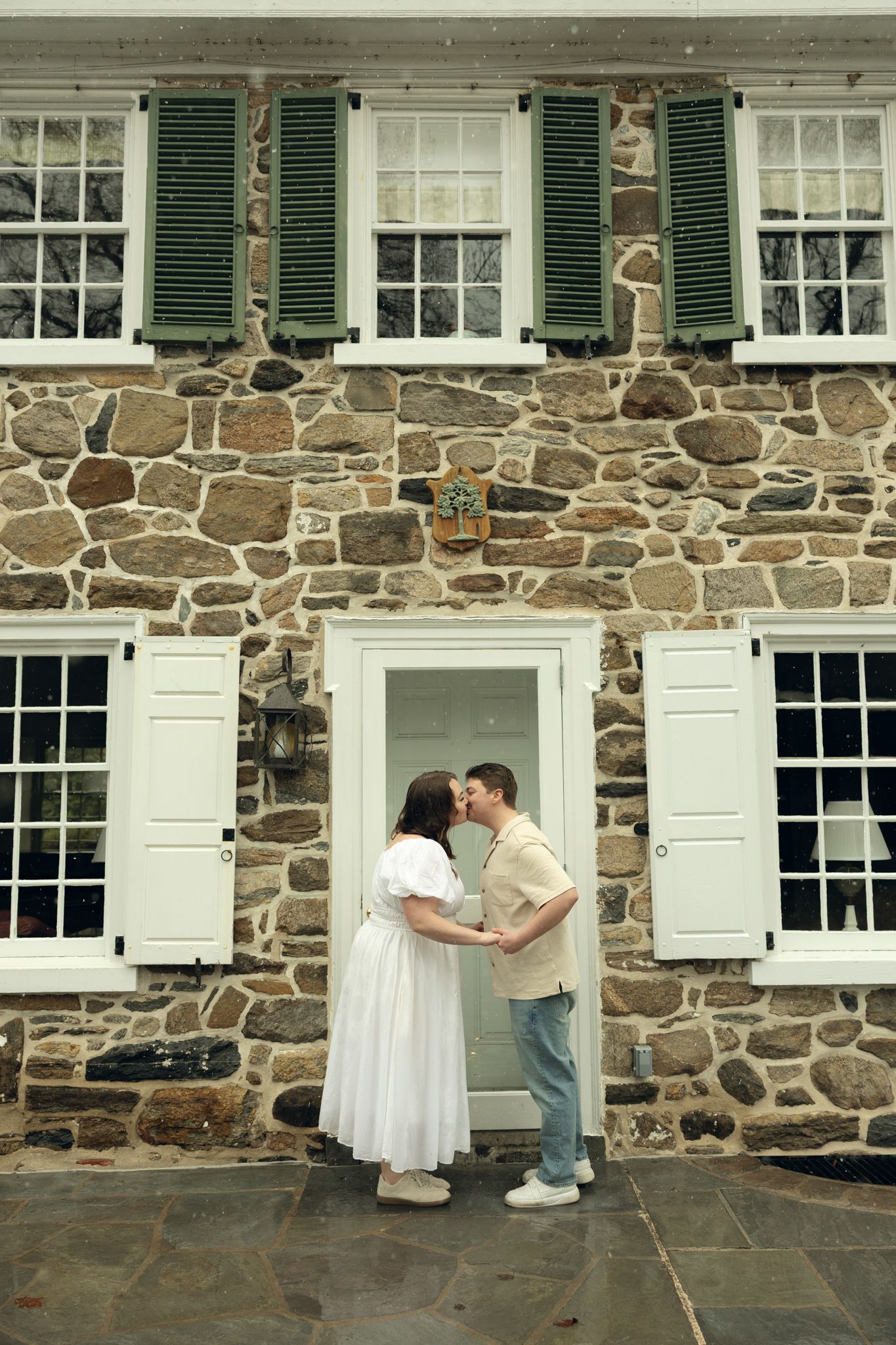 Engagement photos at Appleford Estate in Villanova near Philadelphia capturing a couple sharing intimate moments among gardens