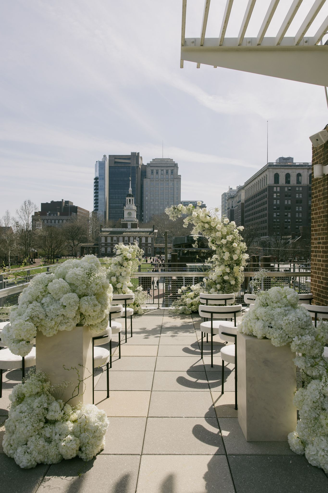 Elegant Liberty View wedding venue in Philadelphia featuring floor-to-ceiling windows, soft neutral tones, and a refined indoor reception se