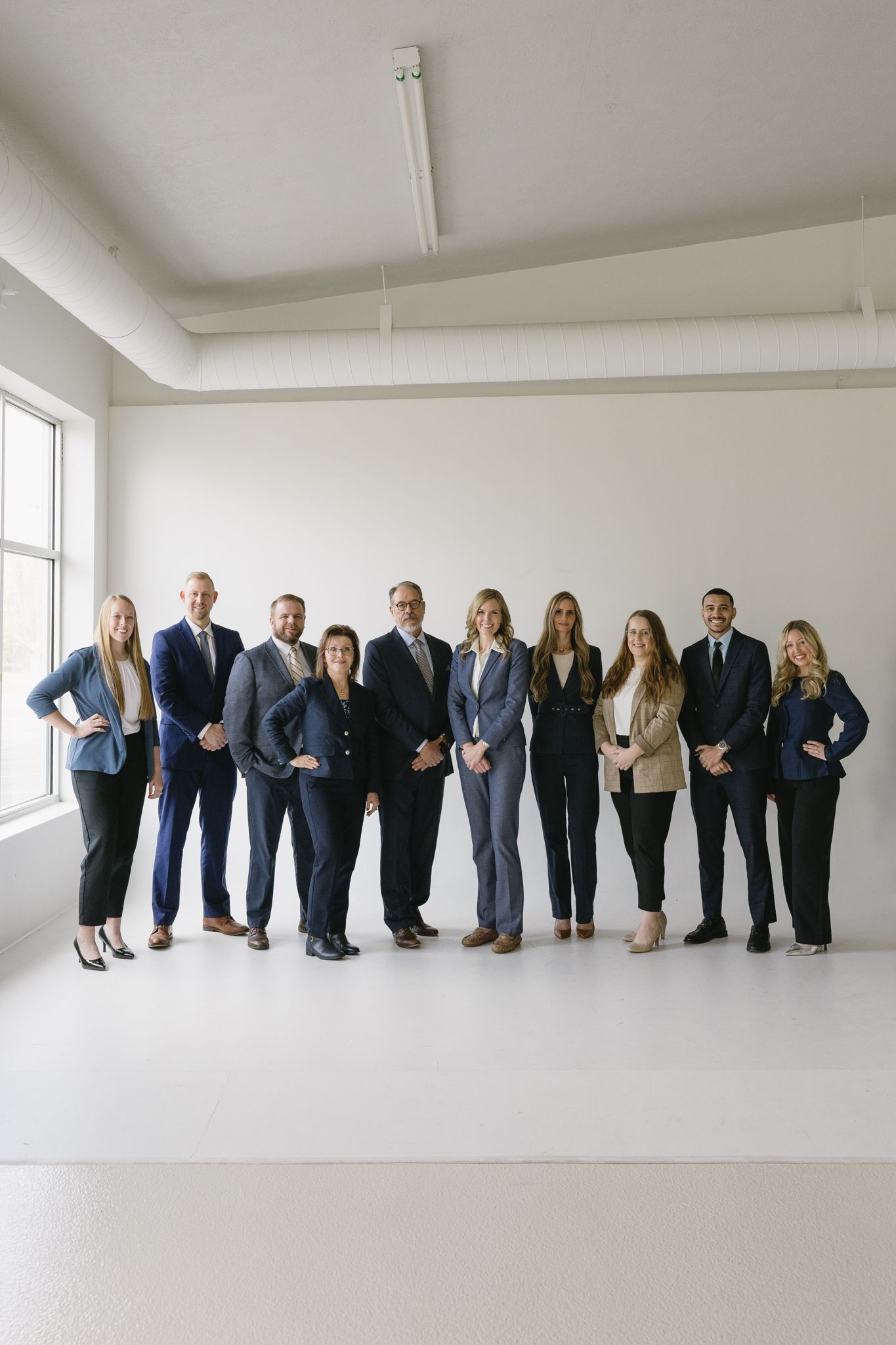 Brand photography in Philadelphia with a small business owner working on a laptop, styled desk details, and candid moments