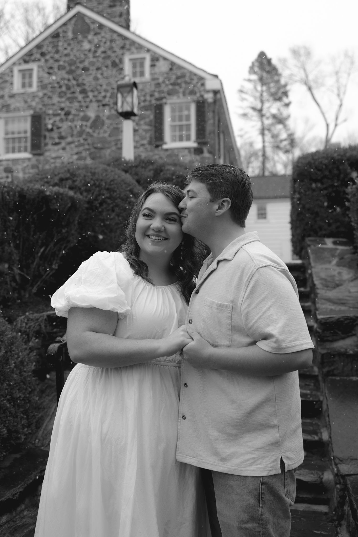 Engagement photos at Appleford Estate in Villanova near Philadelphia capturing a couple sharing intimate moments among gardens