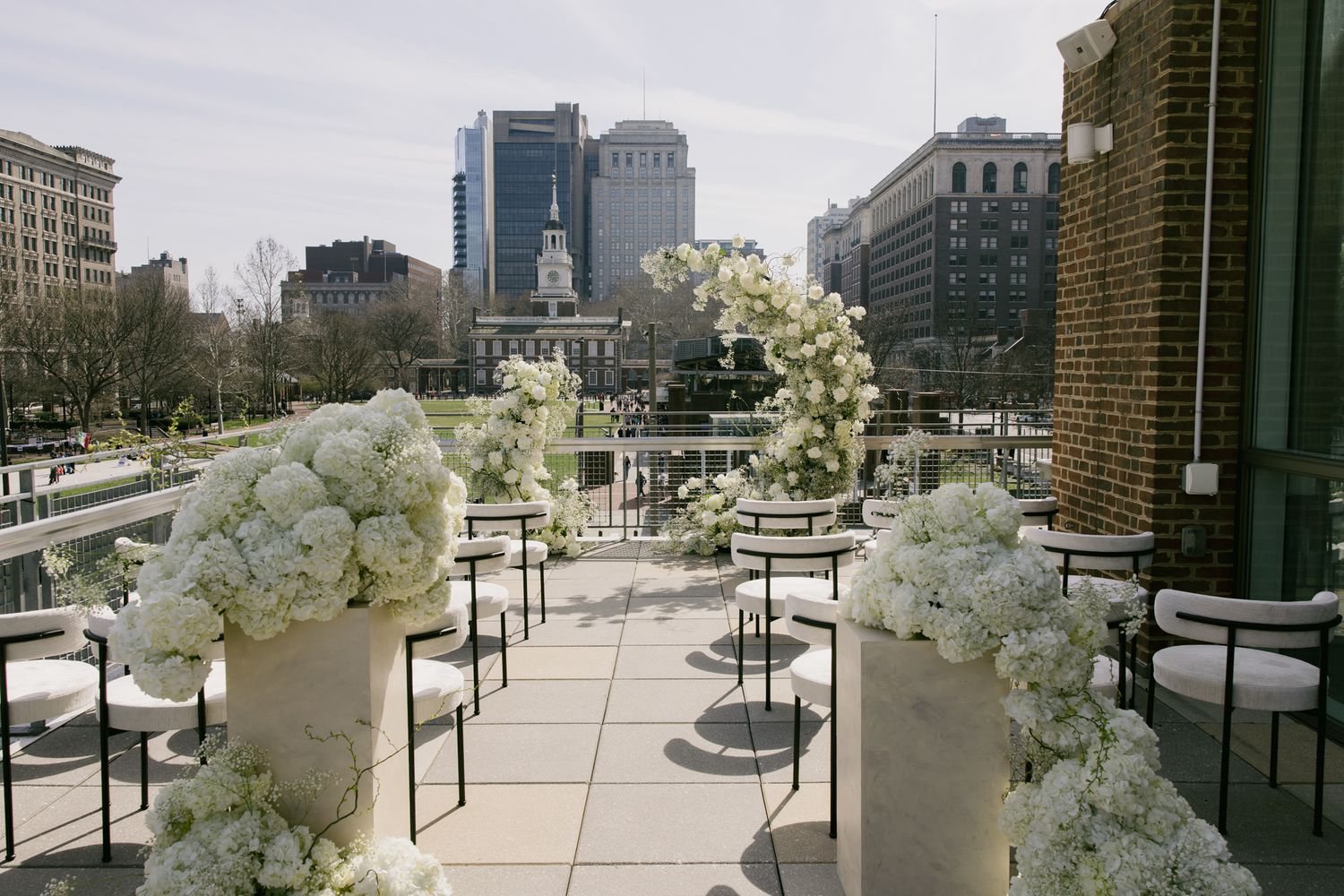 Philadelphia wedding reception at Liberty View with panoramic city views, bright natural light, and a modern, airy event space overlooking h