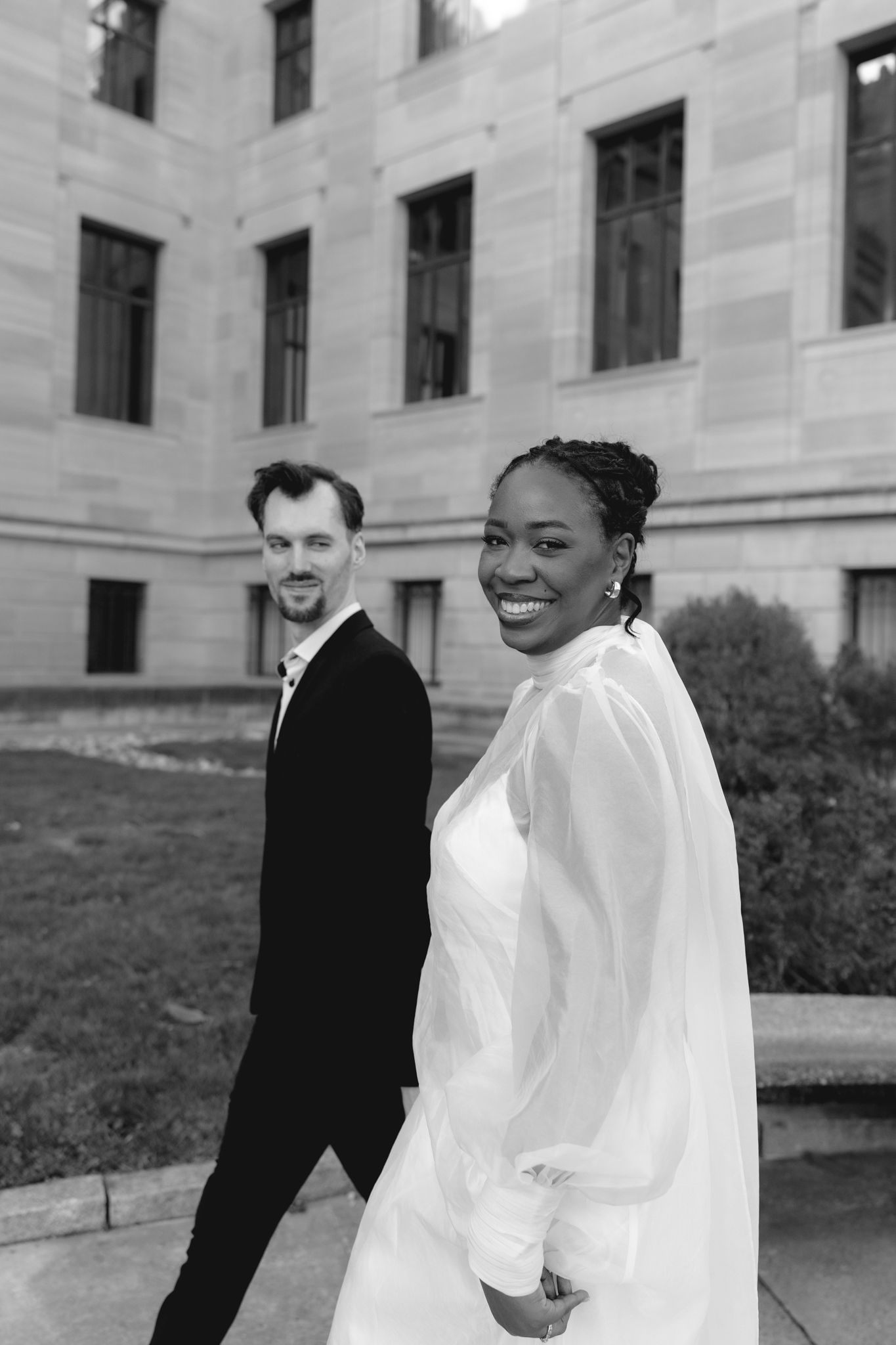 Editorial wedding photography of a bridal couple at the Philadelphia Museum of Art, modern romantic portraits with architectural backdrop