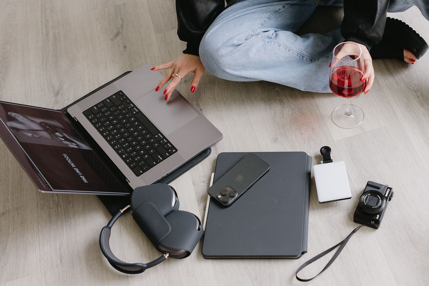 Brand photography in Philadelphia with a small business owner working on a laptop, styled desk details, and candid moments