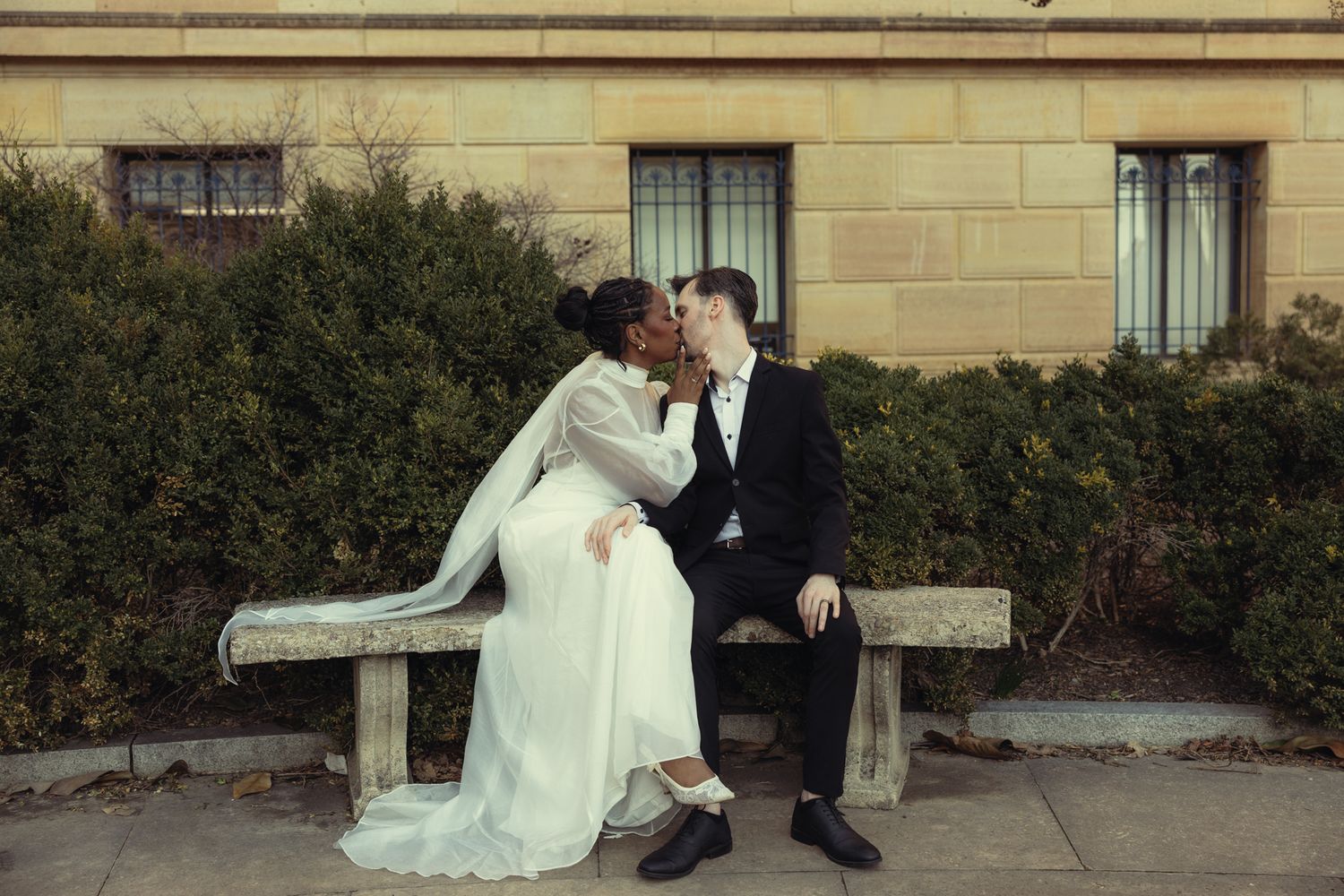 Editorial wedding photography of a bridal couple at the Philadelphia Museum of Art, modern romantic portraits with architectural backdrop