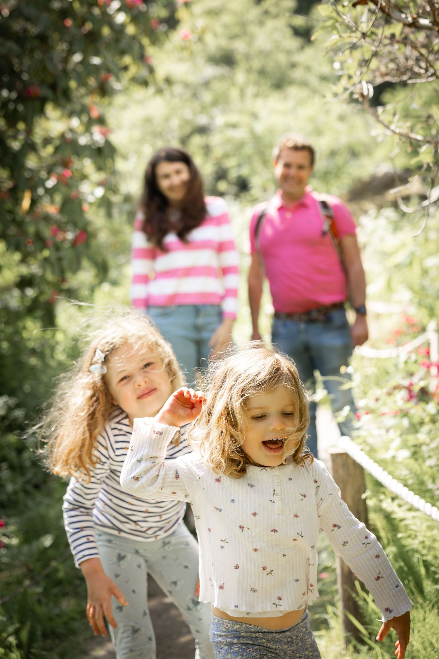 family walking in a garden