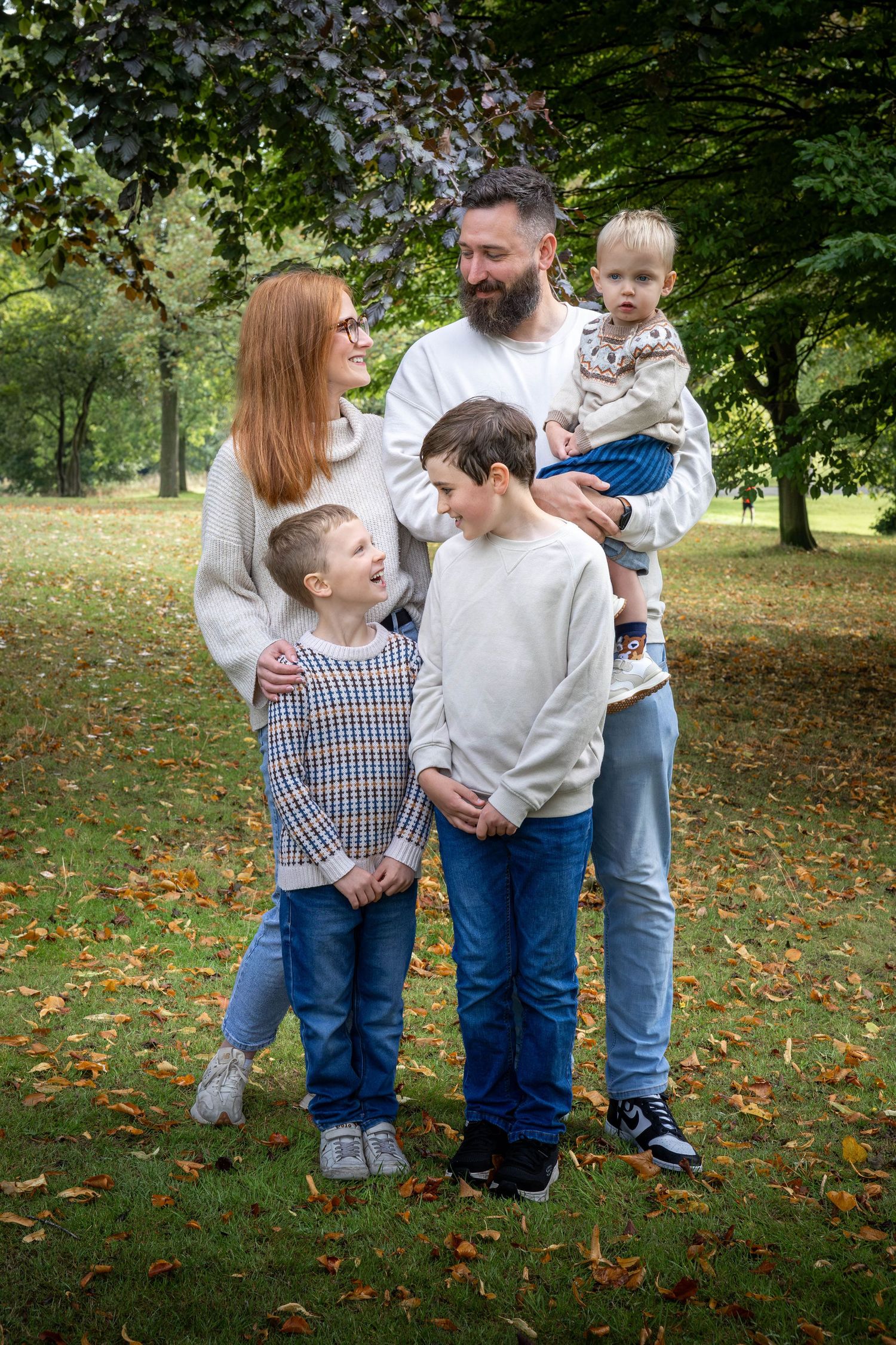 family standing together in a park