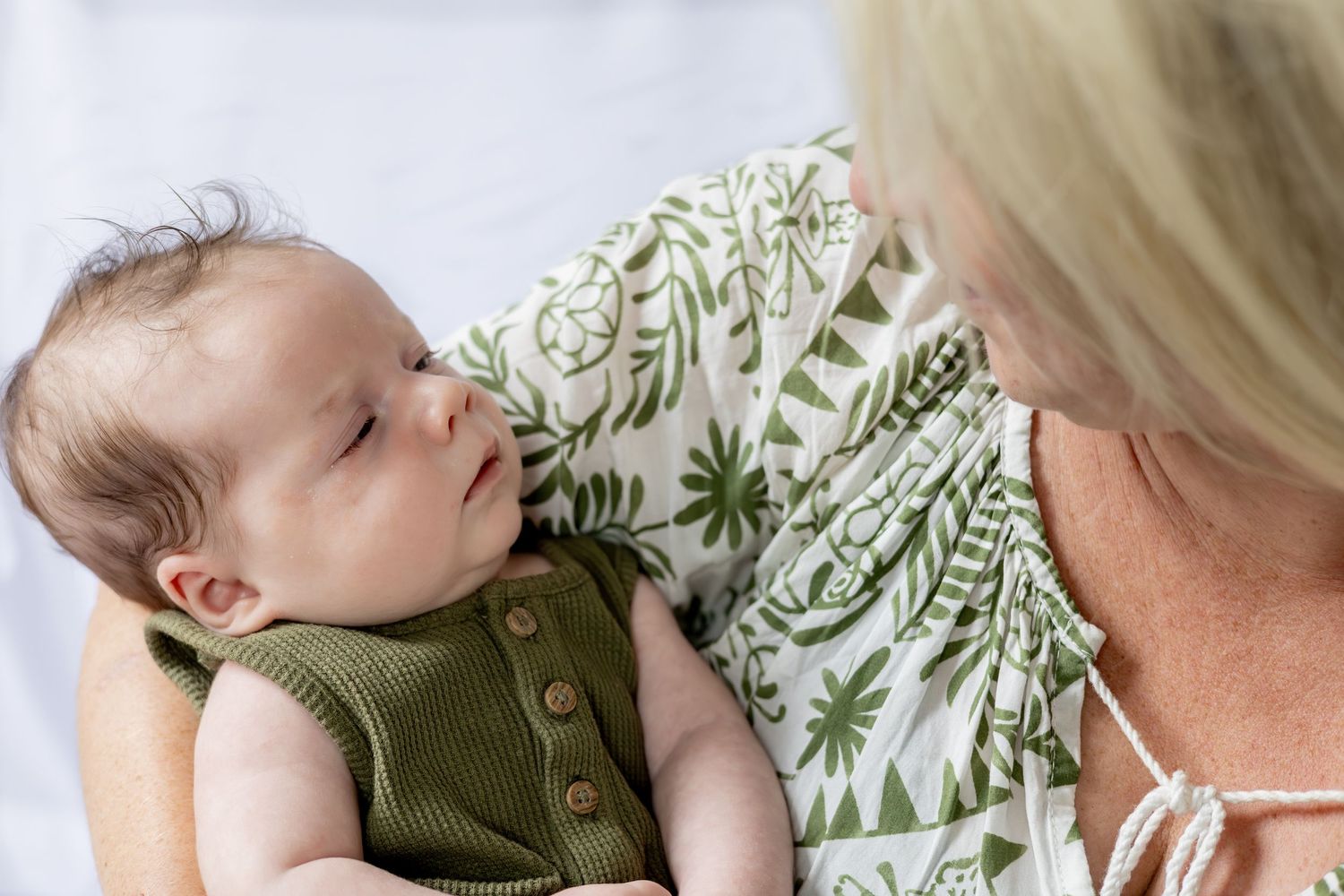 mother holding baby