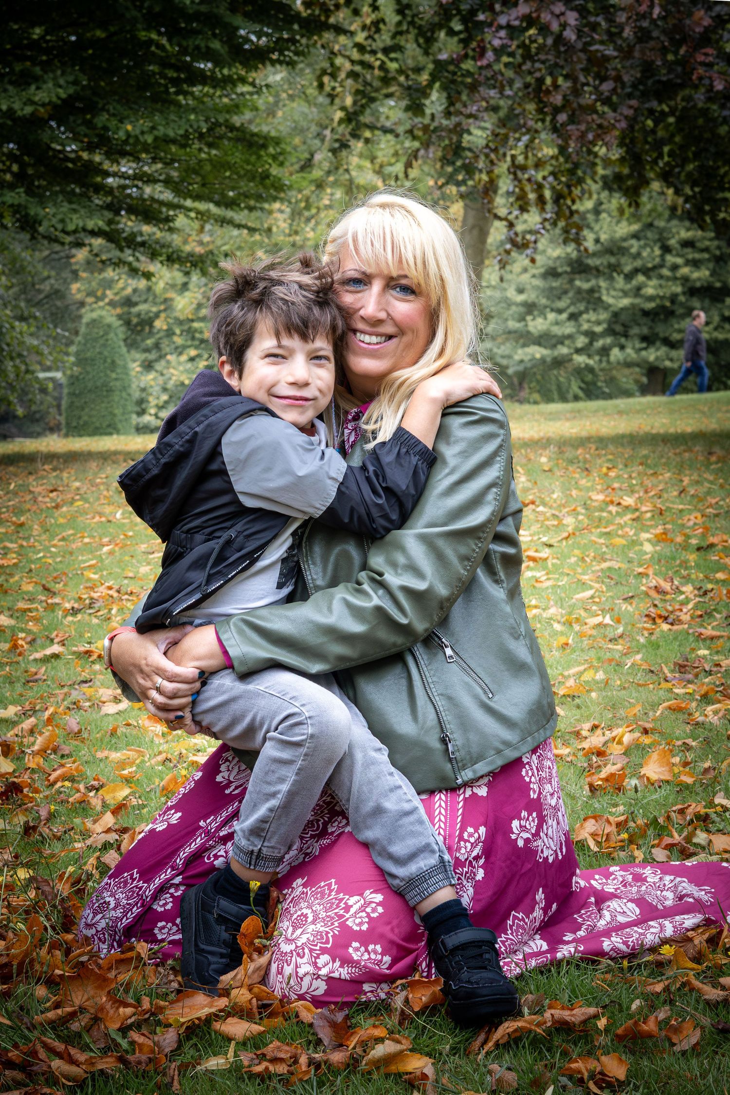 mother and son embracing in park
