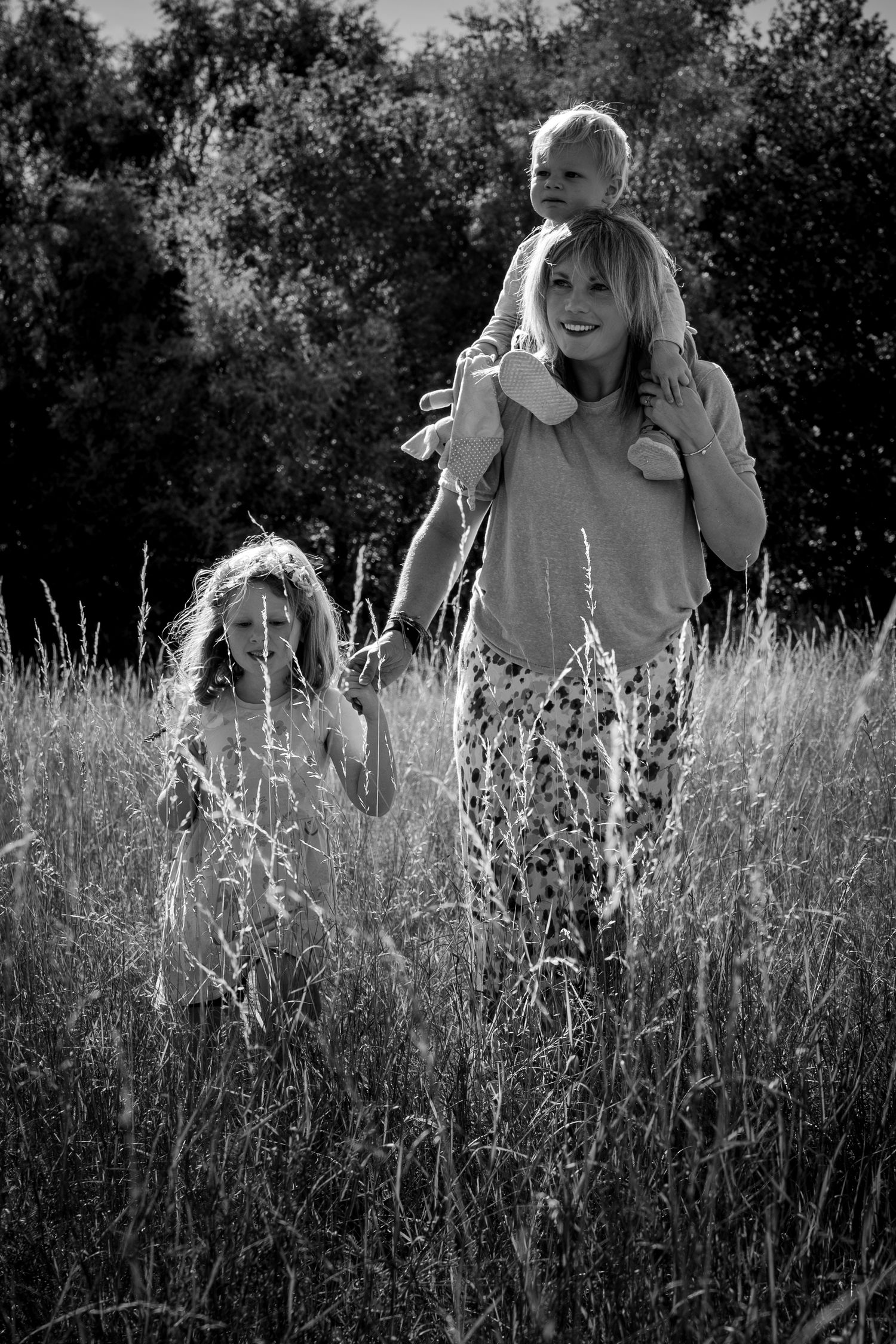 family walking in a meadow