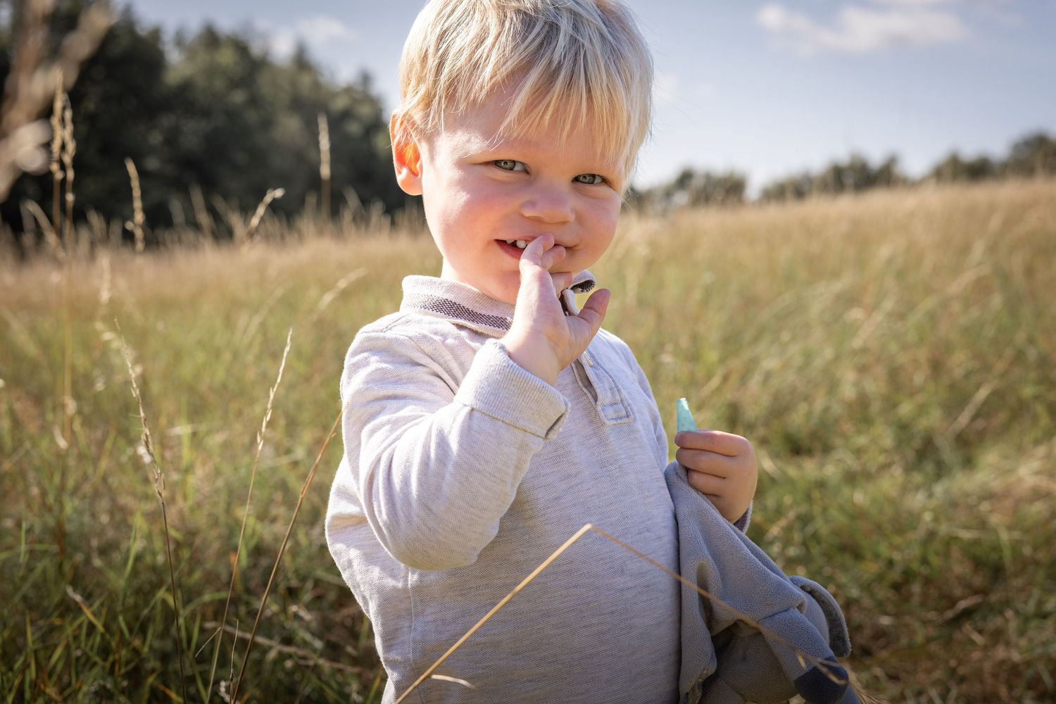 child in grassy meadow