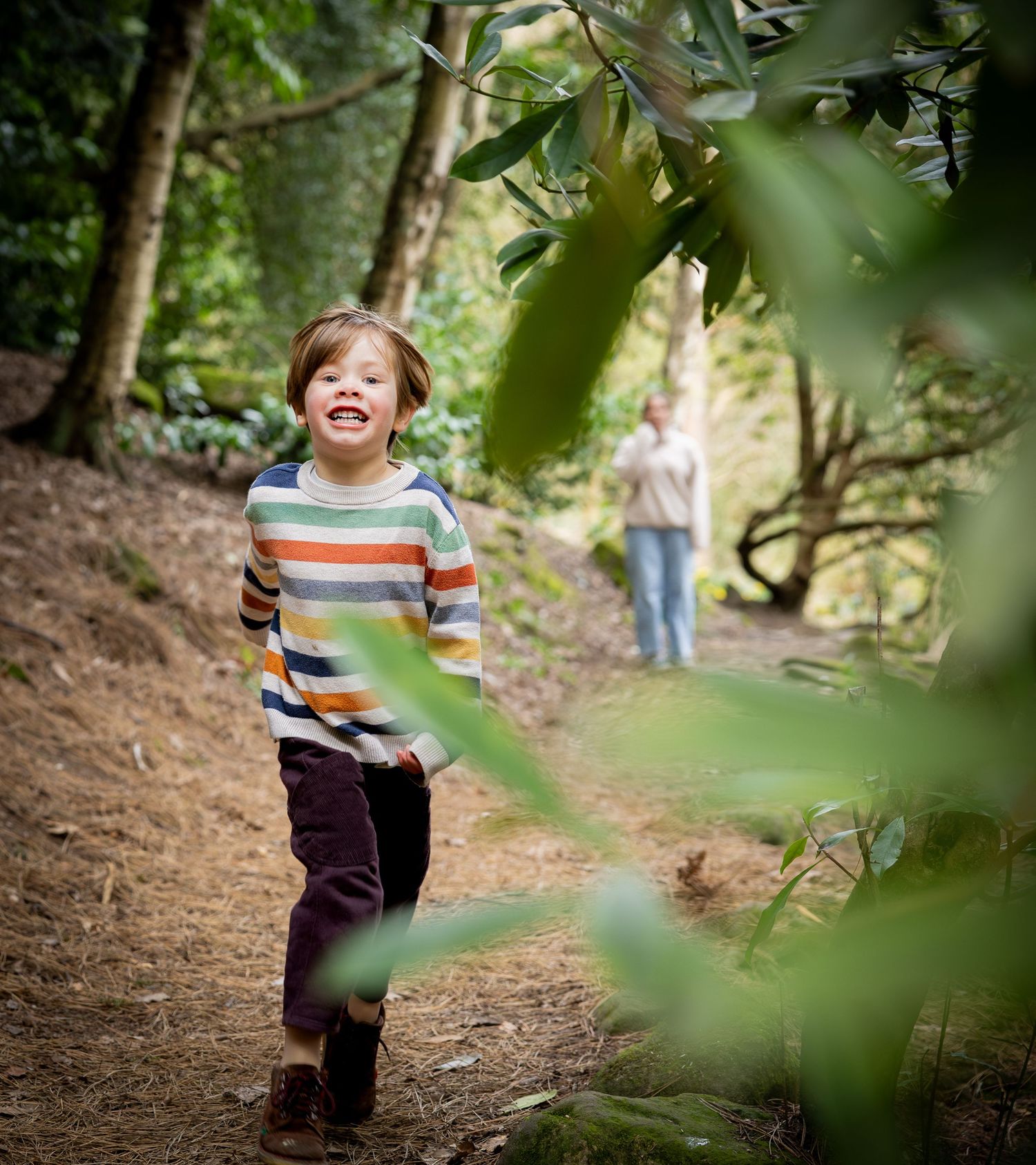 boy running in a wood