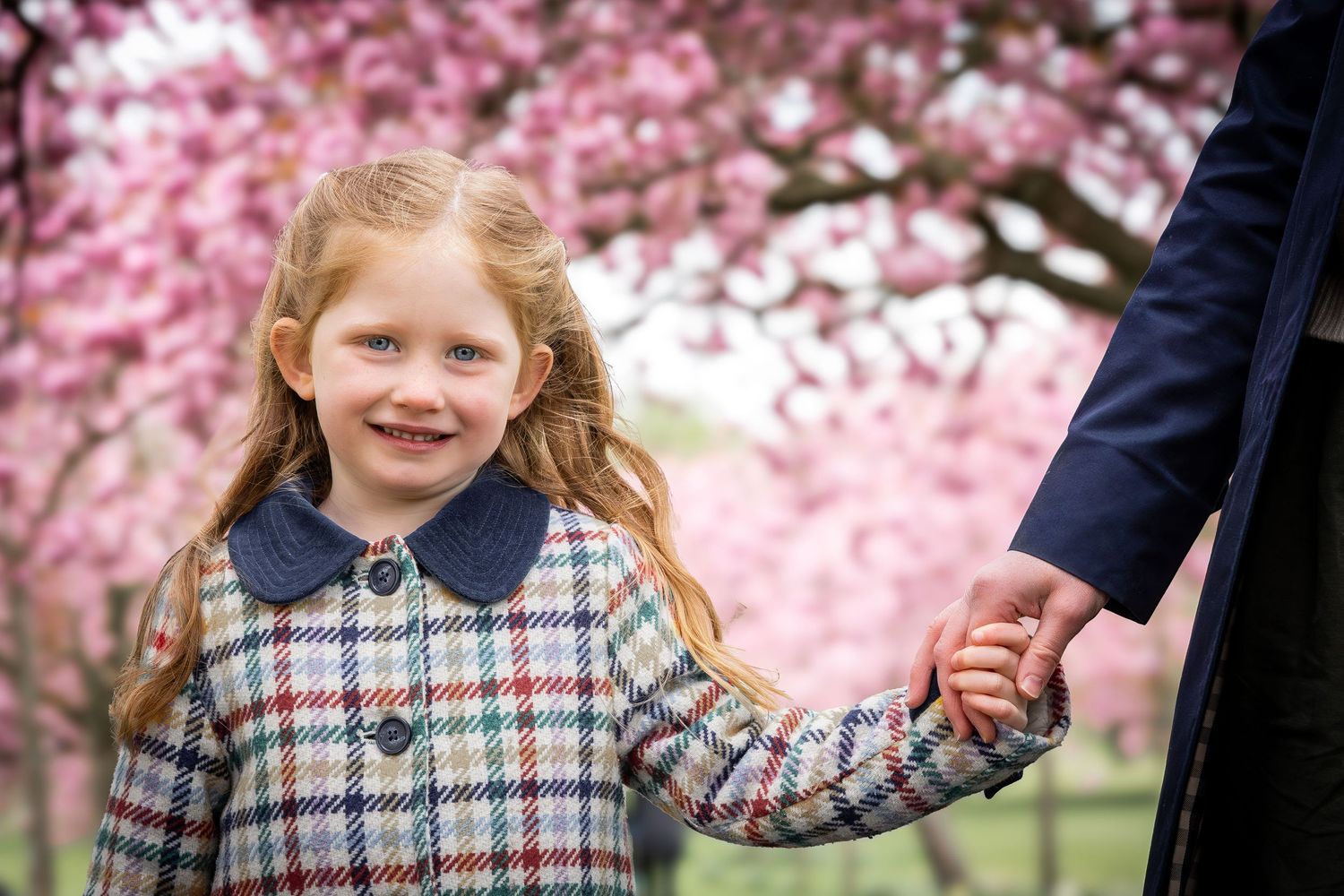 child holding mother's hand