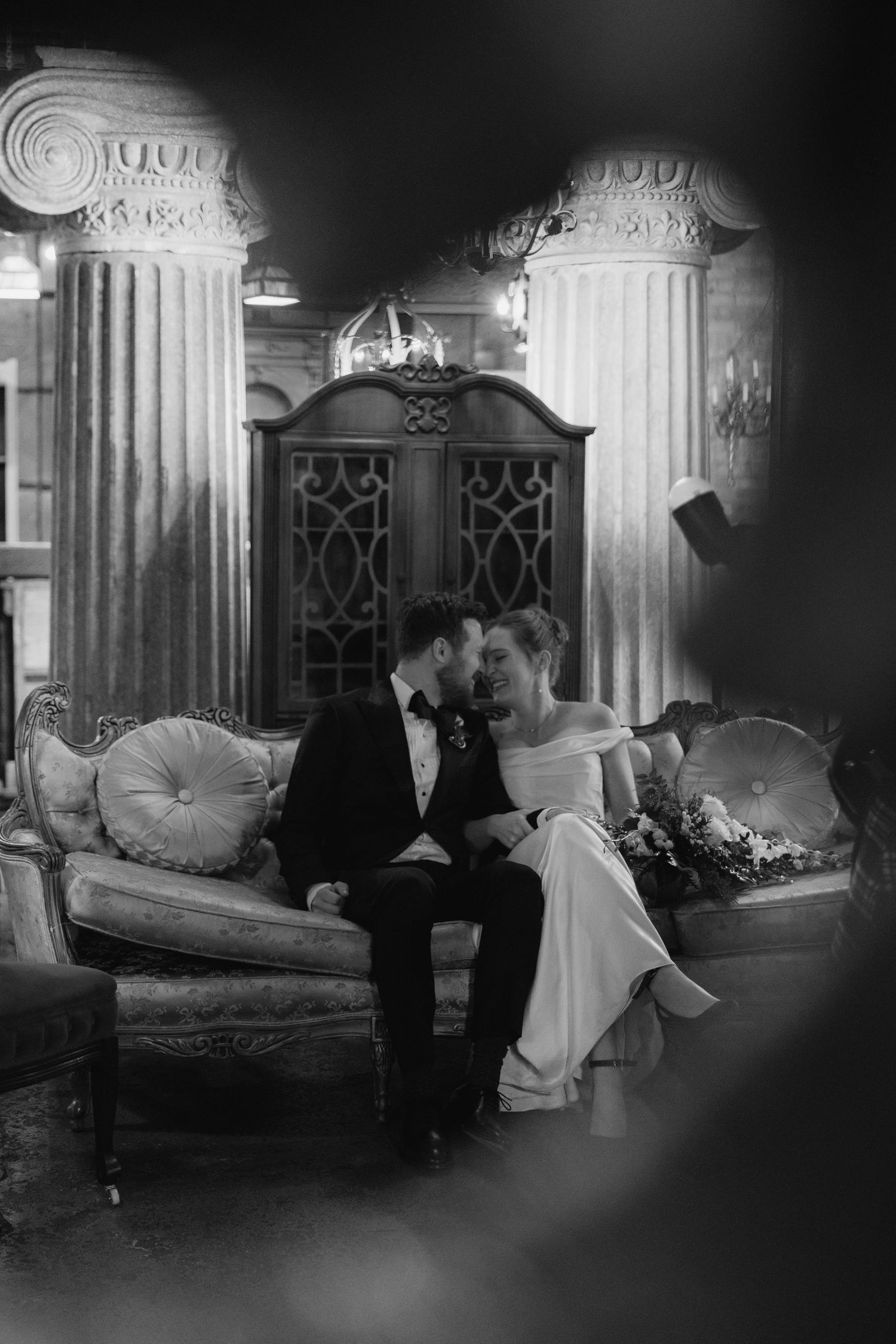 A series of vintage black and white photographs showing couples in formal attire in an elegant Victorian-style parlor setting.