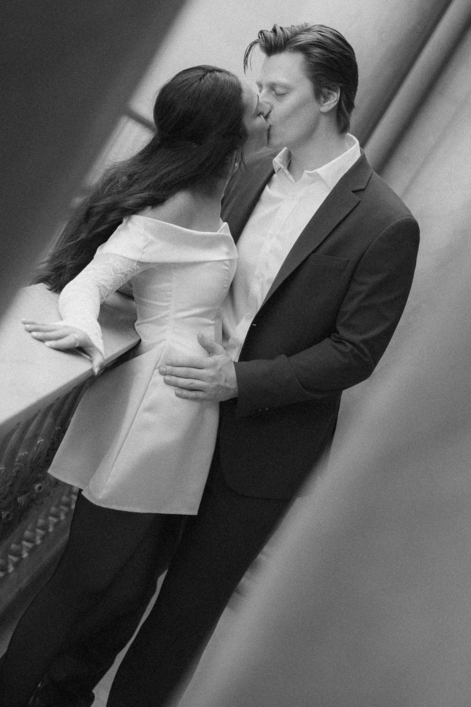 Romantic black and white sequence of a couple embracing in an intimate moment.
