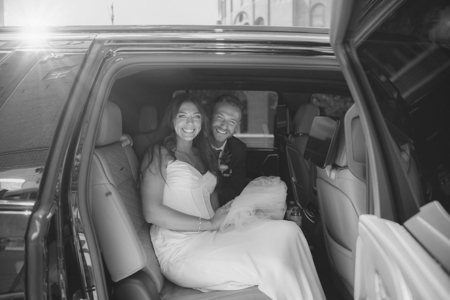 A sequence of black and white photos showing someone sitting in the passenger seat of a car at night.