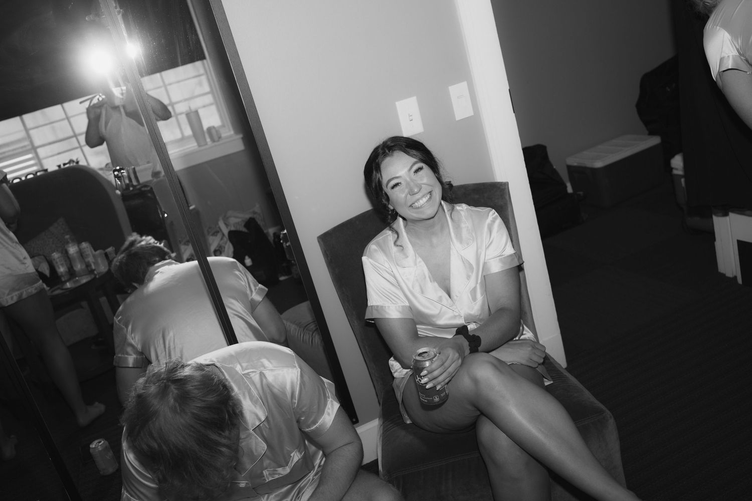 A series of black and white photos showing people in casual indoor settings engaged in various activities.