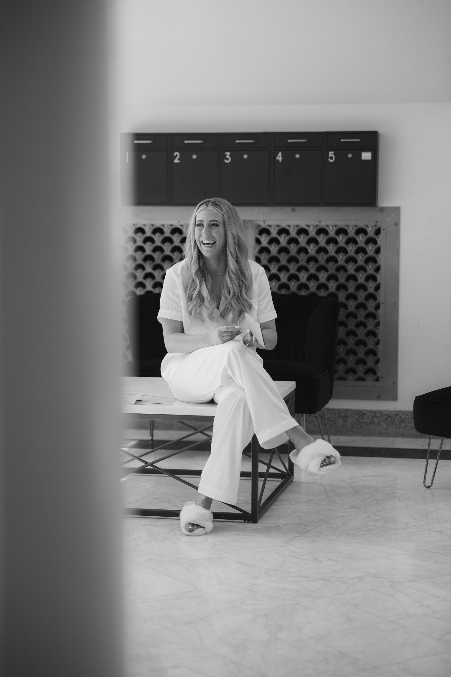 A series of black and white photos showing someone in white clothing lying on a carpeted floor near a wall vent.