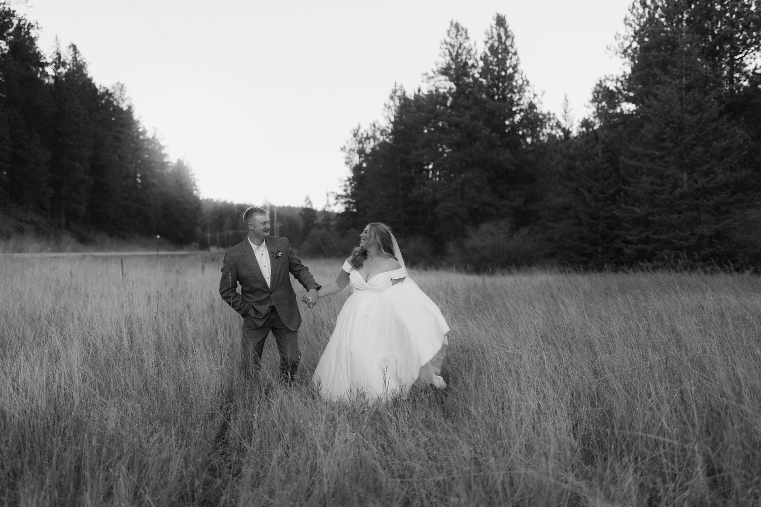 Black and white sequence of a couple walking through tall grass.
