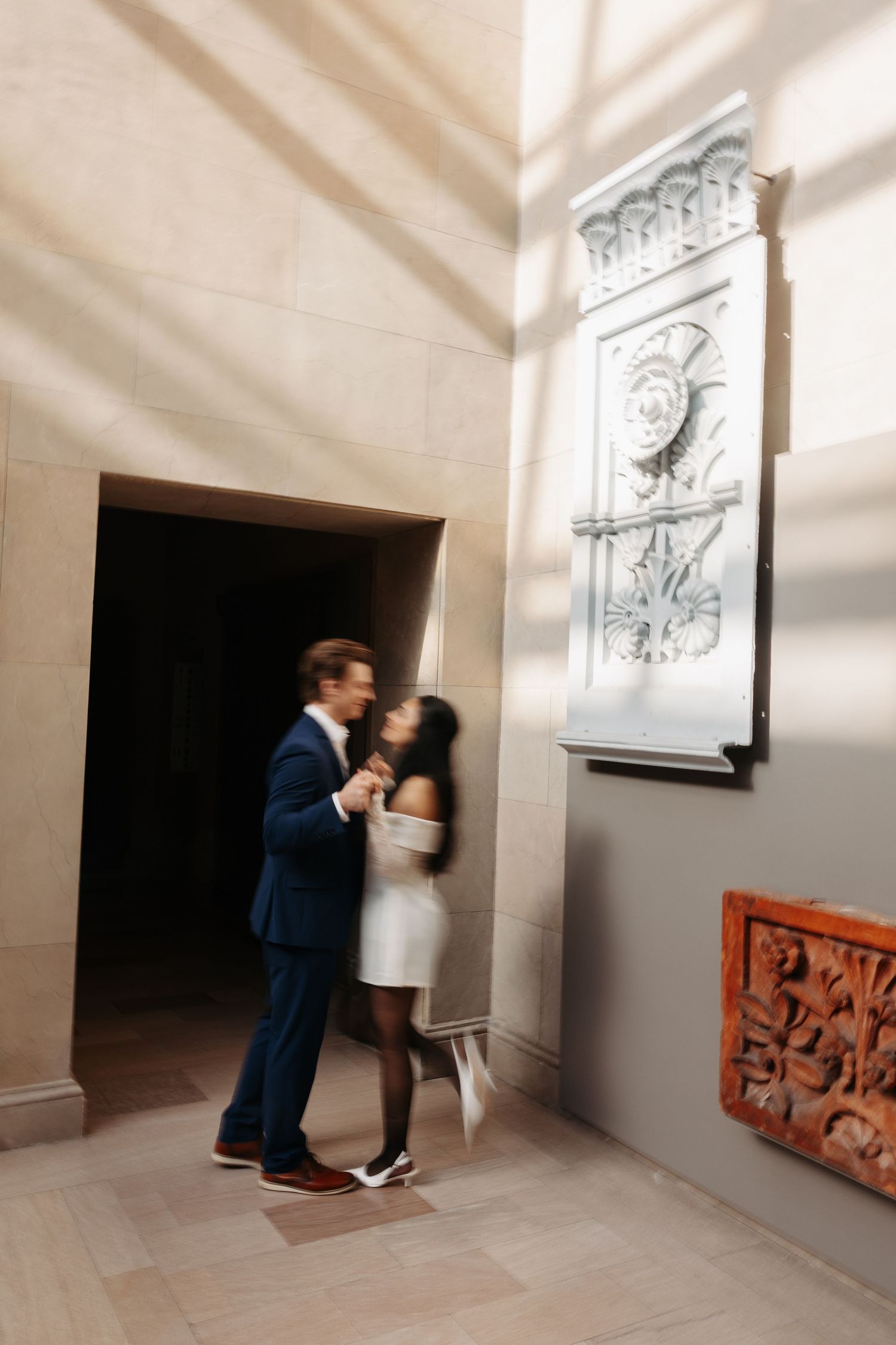 Sequence of artistic wedding photos showing a couple dancing in an elegant white hallway.