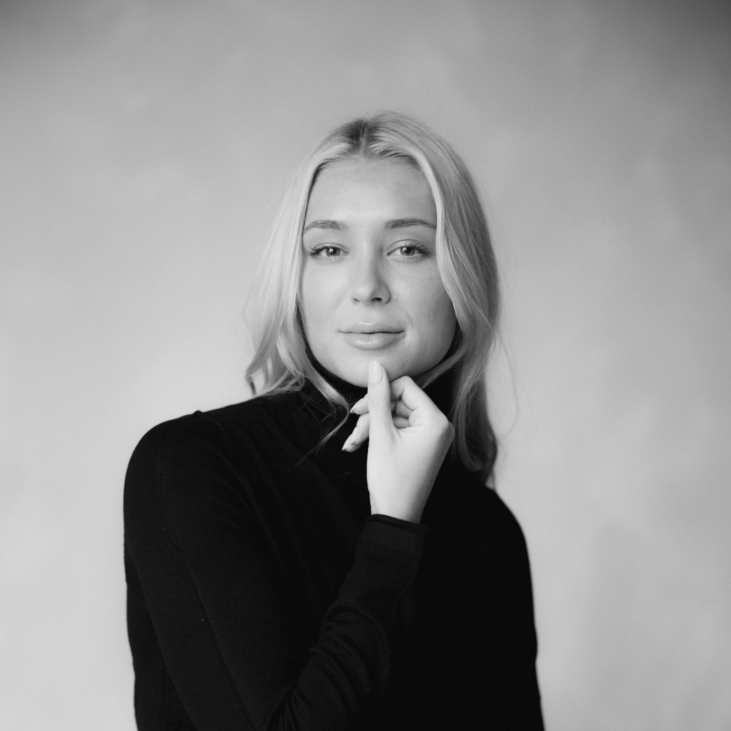 Minimalist black and white photo series featuring artistic expressions in studio environment.