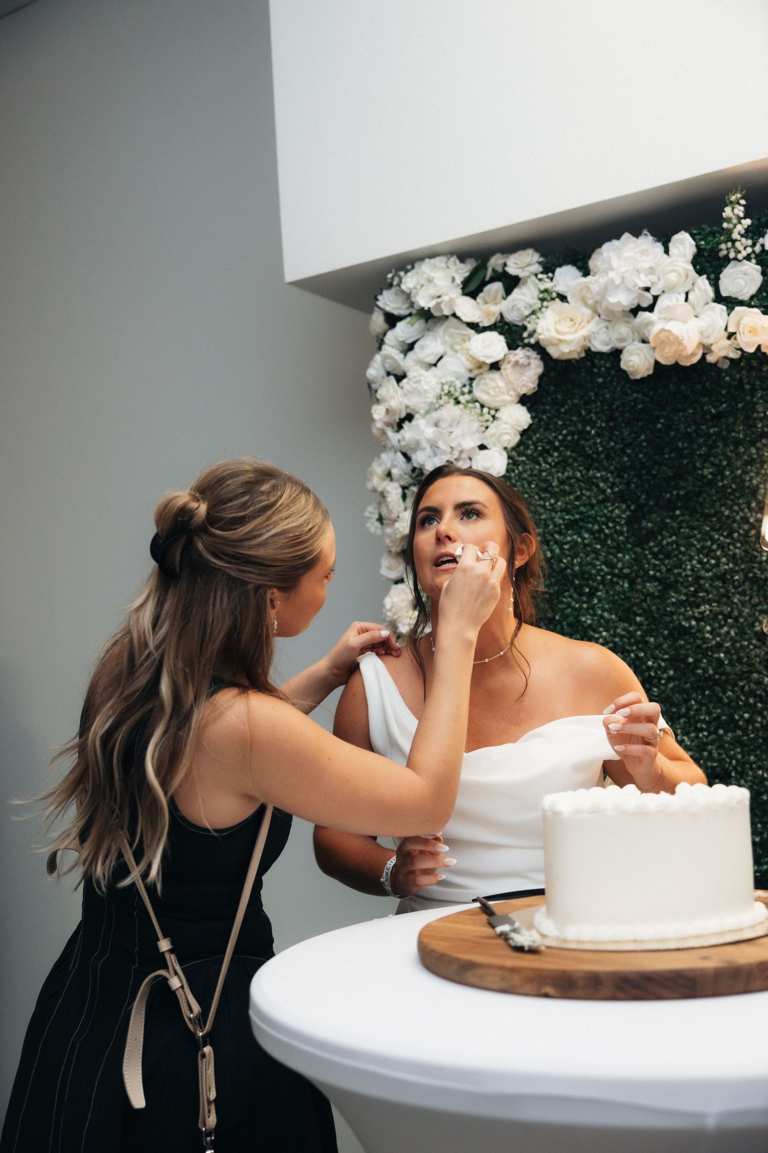 A sequence showing someone playfully smashing cake into another person's face during a celebration.