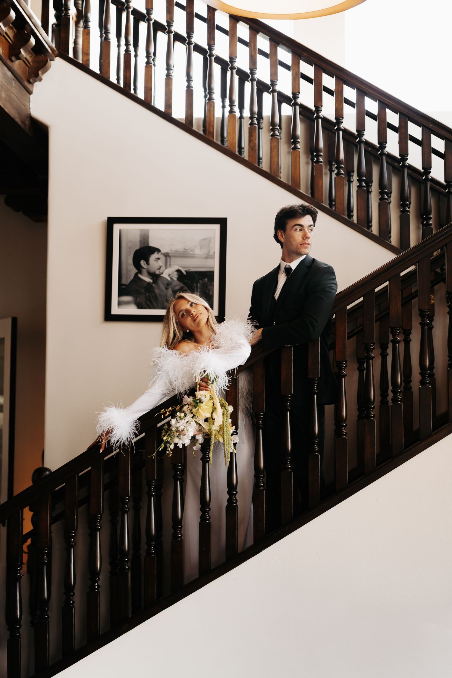 A series of artistic wedding photos showing couple interacting playfully on a staircase with dark wood railing.