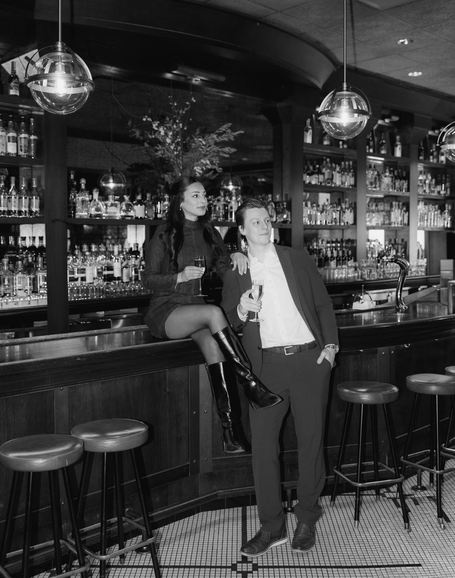 A black and white photo sequence showing a person leaning against a long bar counter in different casual poses.
