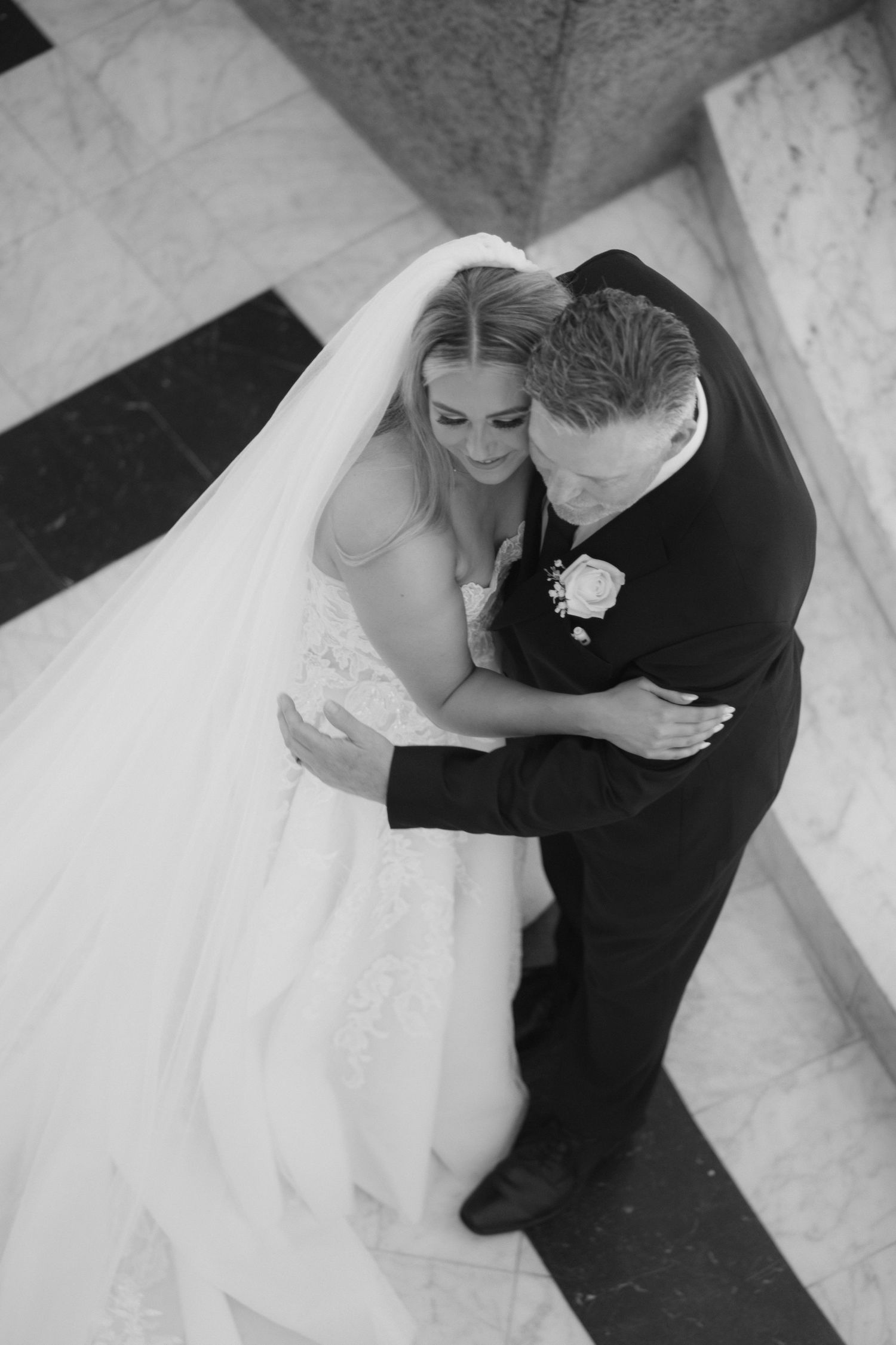 A romantic black and white photo series showing a bride and groom embracing from different angles on their wedding day.
