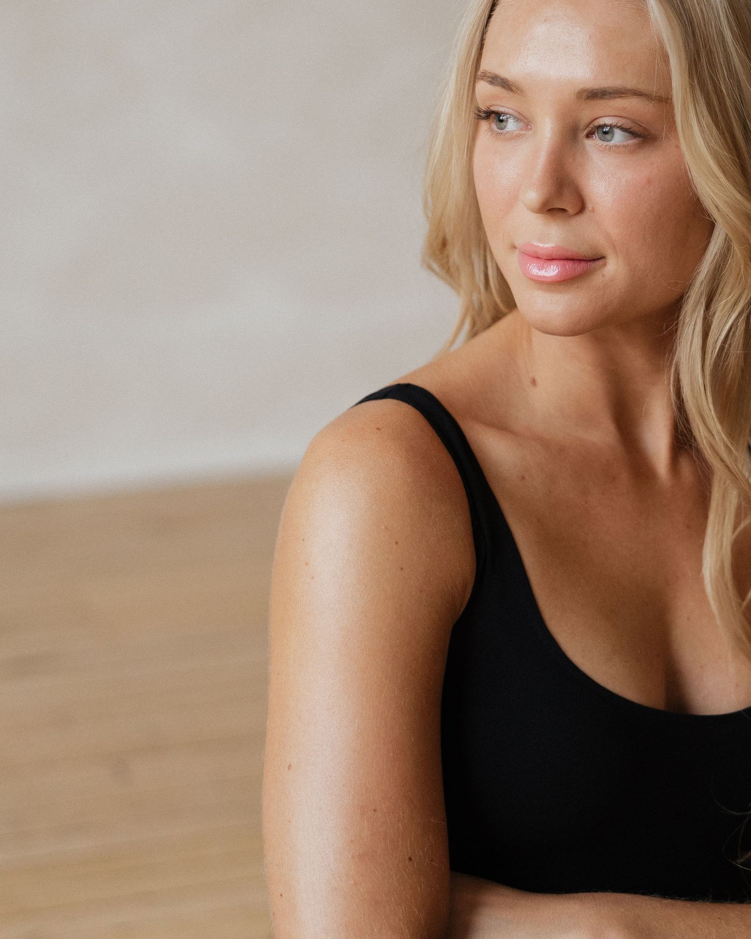 Warm-toned lifestyle portraits showcasing natural expressions against a minimalist studio backdrop.
