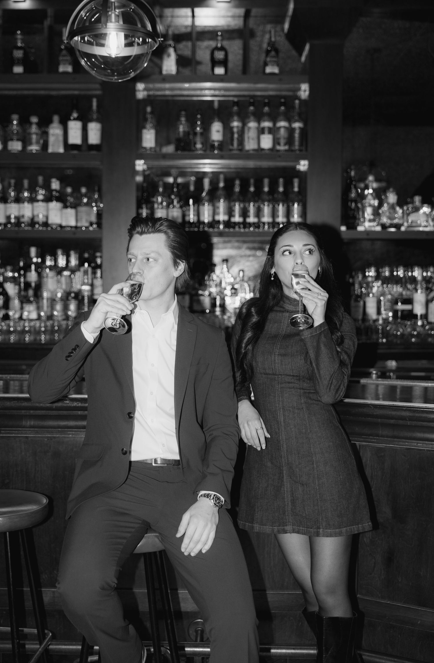 Black and white photo series showing people at a bar counter with bottles displayed in the background.