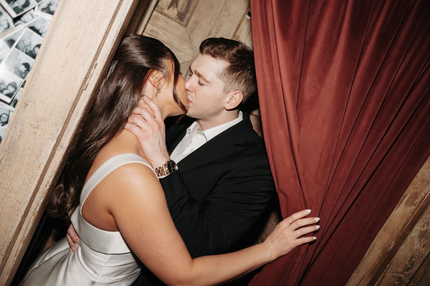 A sequence of black and white wedding photos showing a couple embracing by a dramatic red curtain.