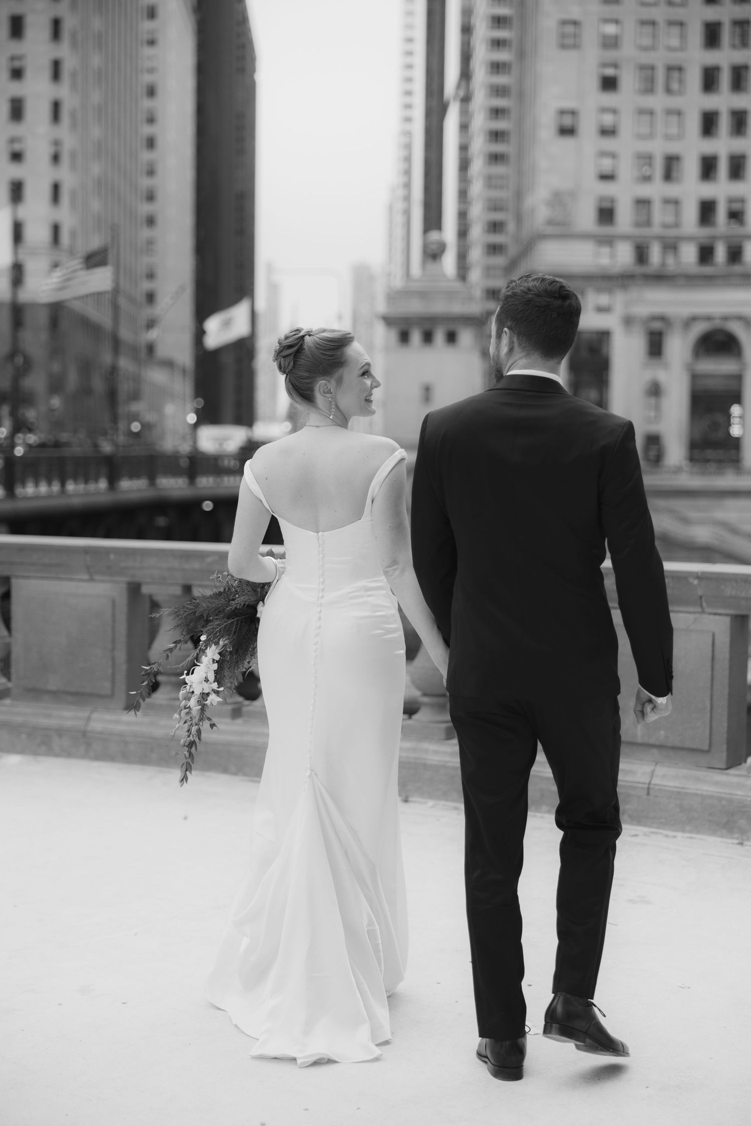 A bride and groom walking together in a sequence of black and white photos showing them from different angles.