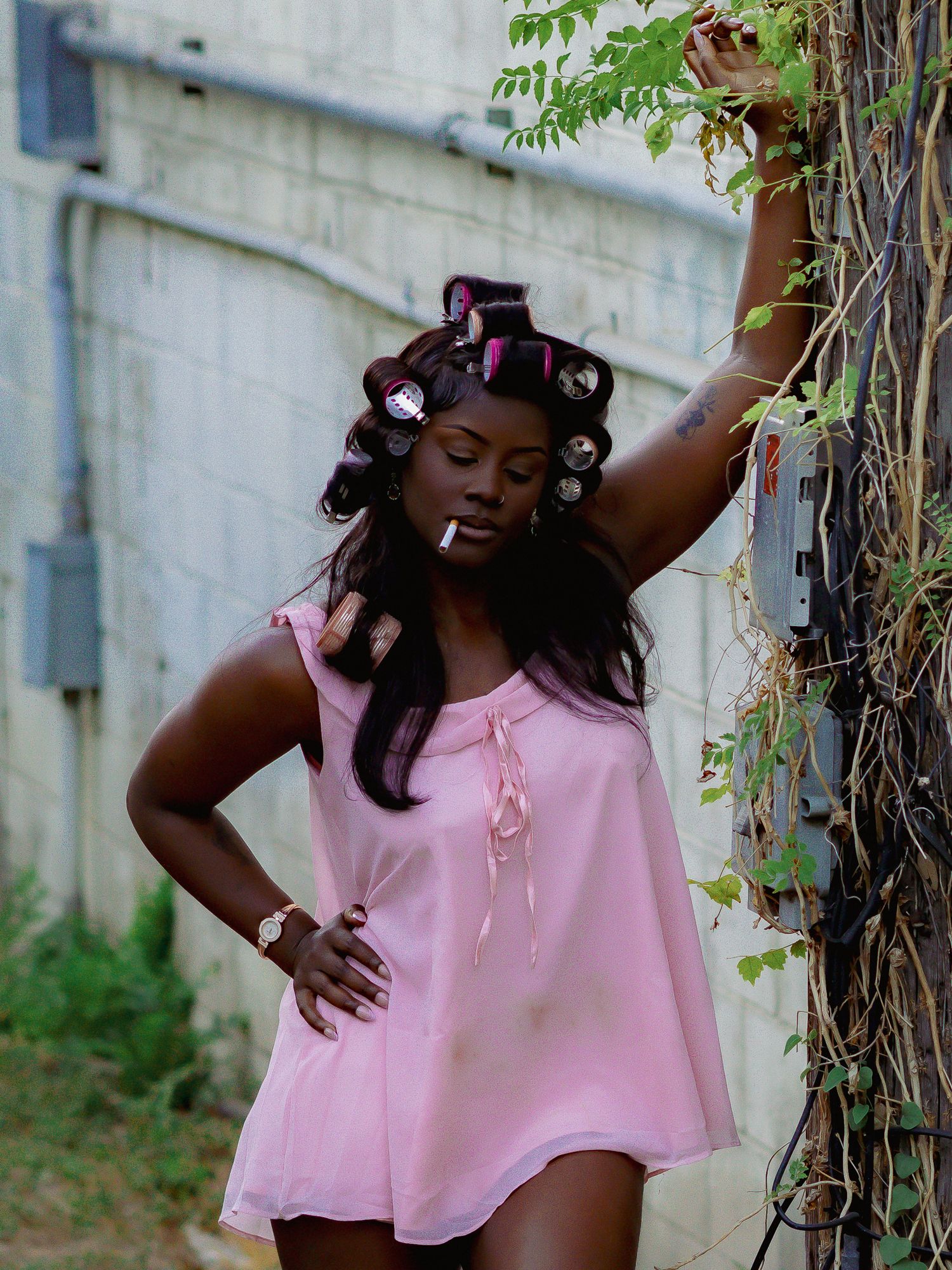 Artistic movement series photographed outdoors with natural foliage background.