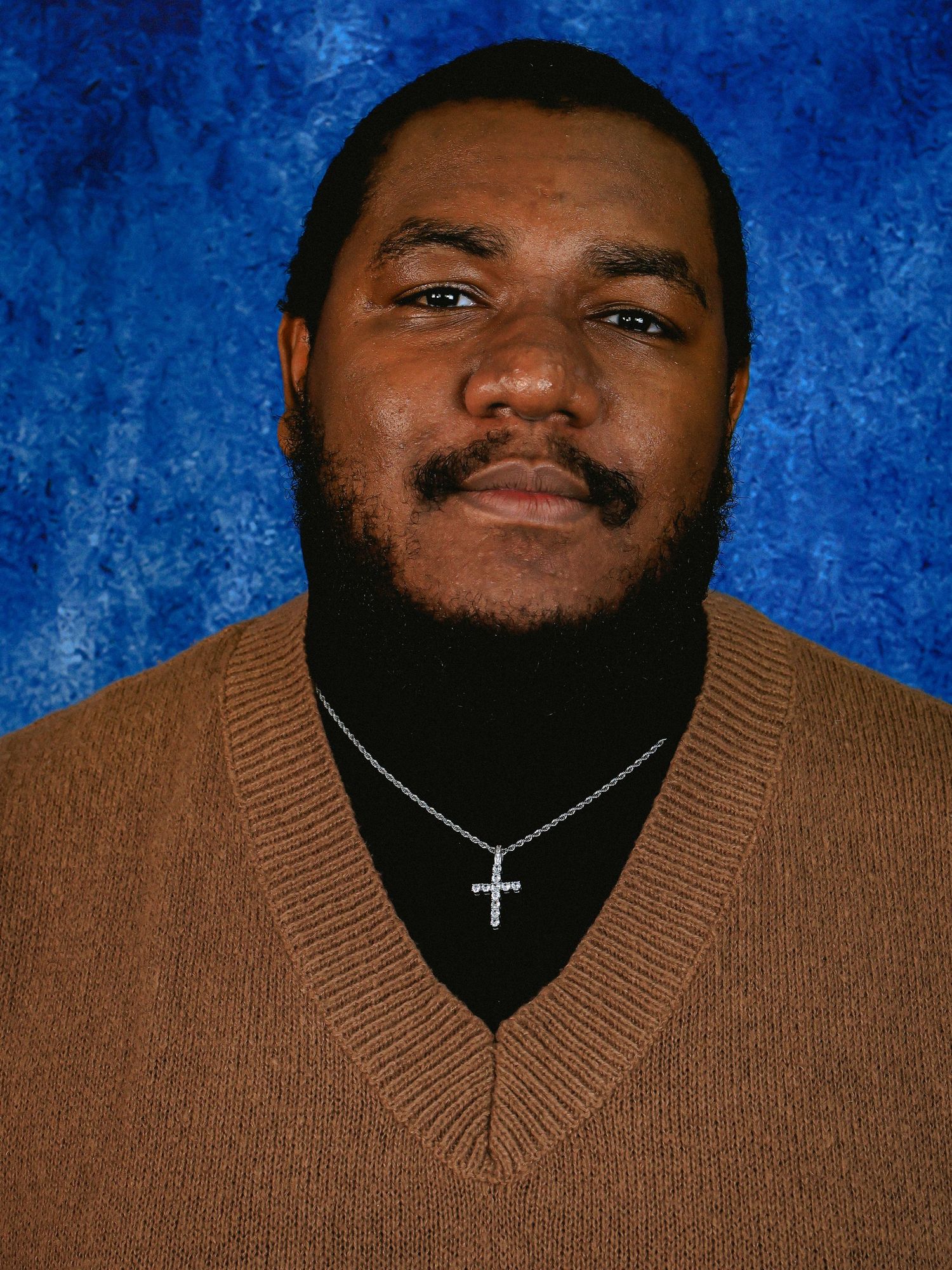 Portrait series showing different facial expressions against blue background.