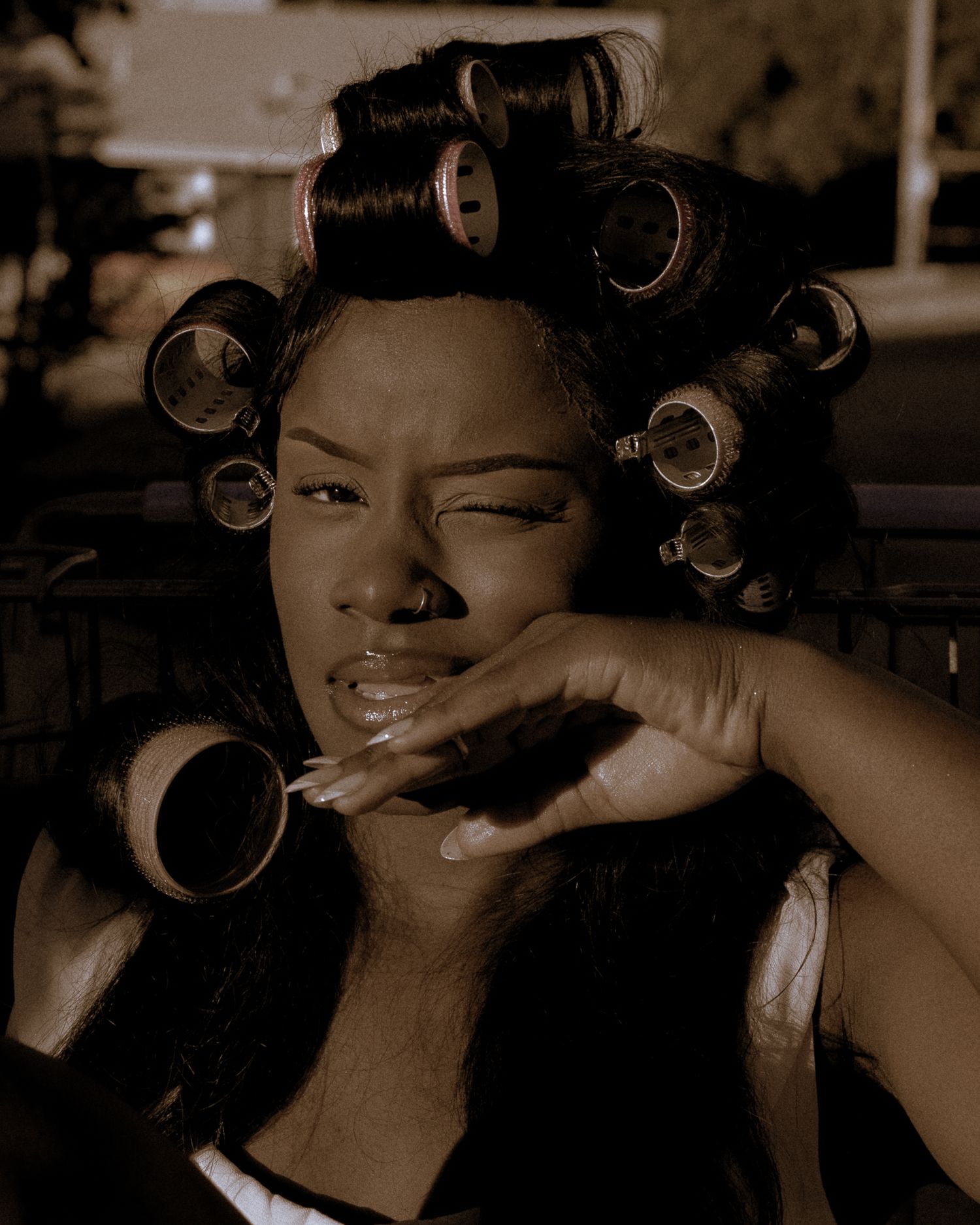 Sepia-toned portrait series showing dynamic poses and styling preparation.