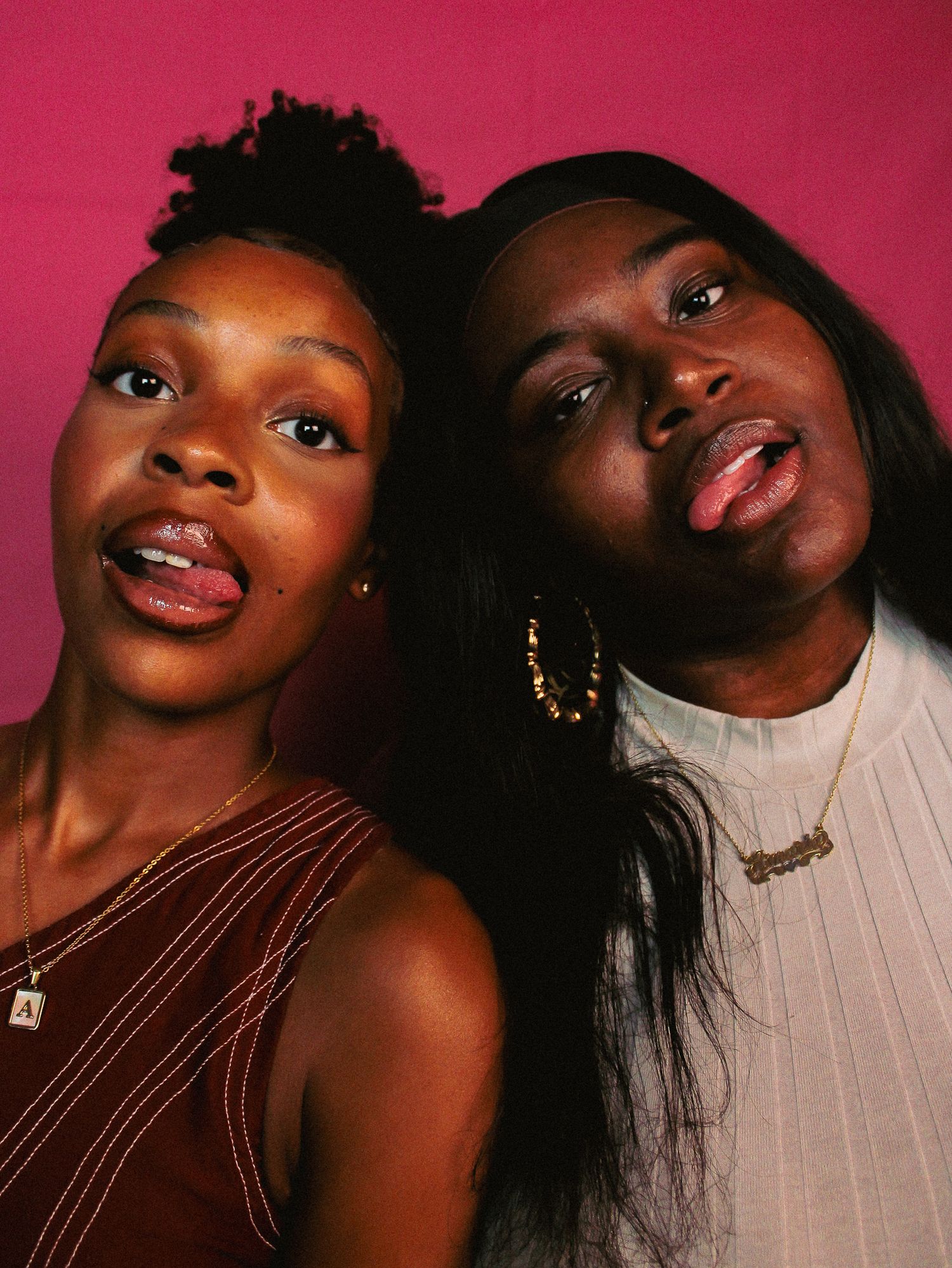 Two people share animated expressions in series of photos against pink backdrop.